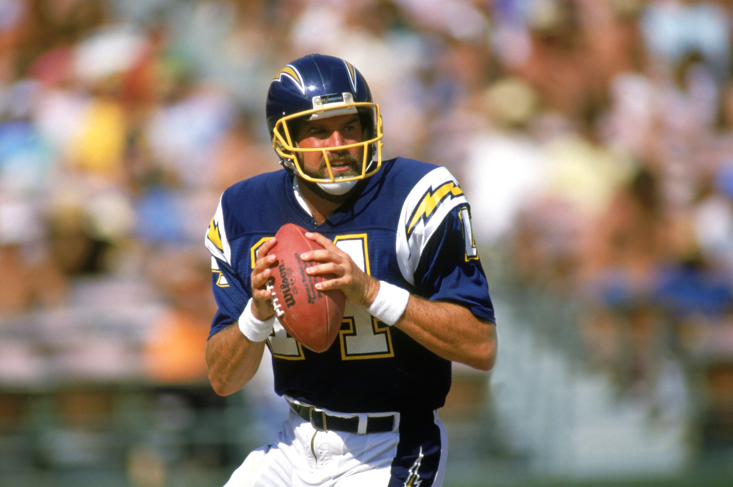 SAN DIEGO -1987: Dan Fouts #14 of the San Diego Chargers looks to pass during a 1987 NFL season game at Jack Murphy Stadium in San Diego, California. ( Photo by: Stephen Dunn/Getty Images)