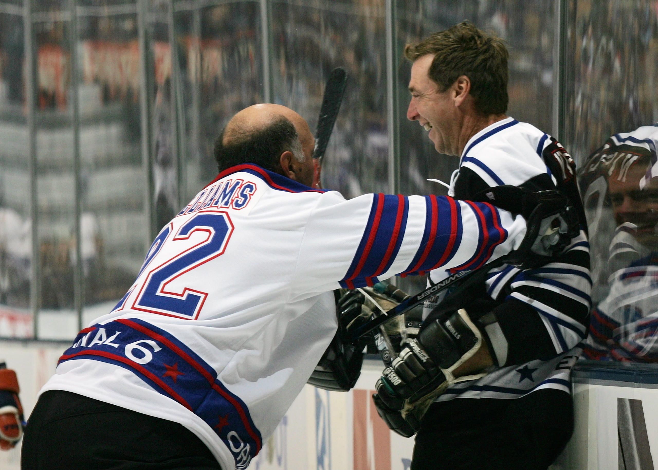 TORONTO, ON - NOVEMBER 11: Dave Tiger Williams #22 of the Original Six Lengends boards Bernie Nicholls #9 of the Expansion legends during the Legends Classic Game on November 11, 2007 at the Air Canada Centre in Toronto, Ontario, Canada. (Photo by Bruce TORONTO, ON - NOVEMBER 11: Dave Tiger Williams #22 of the Original Six Lengends boards Bernie Nicholls #9 of the Expansion legends during the Legends Classic Game on November 11, 2007 at the Air Canada Centre in Toronto, Ontario, Canada. (Photo by Bruce