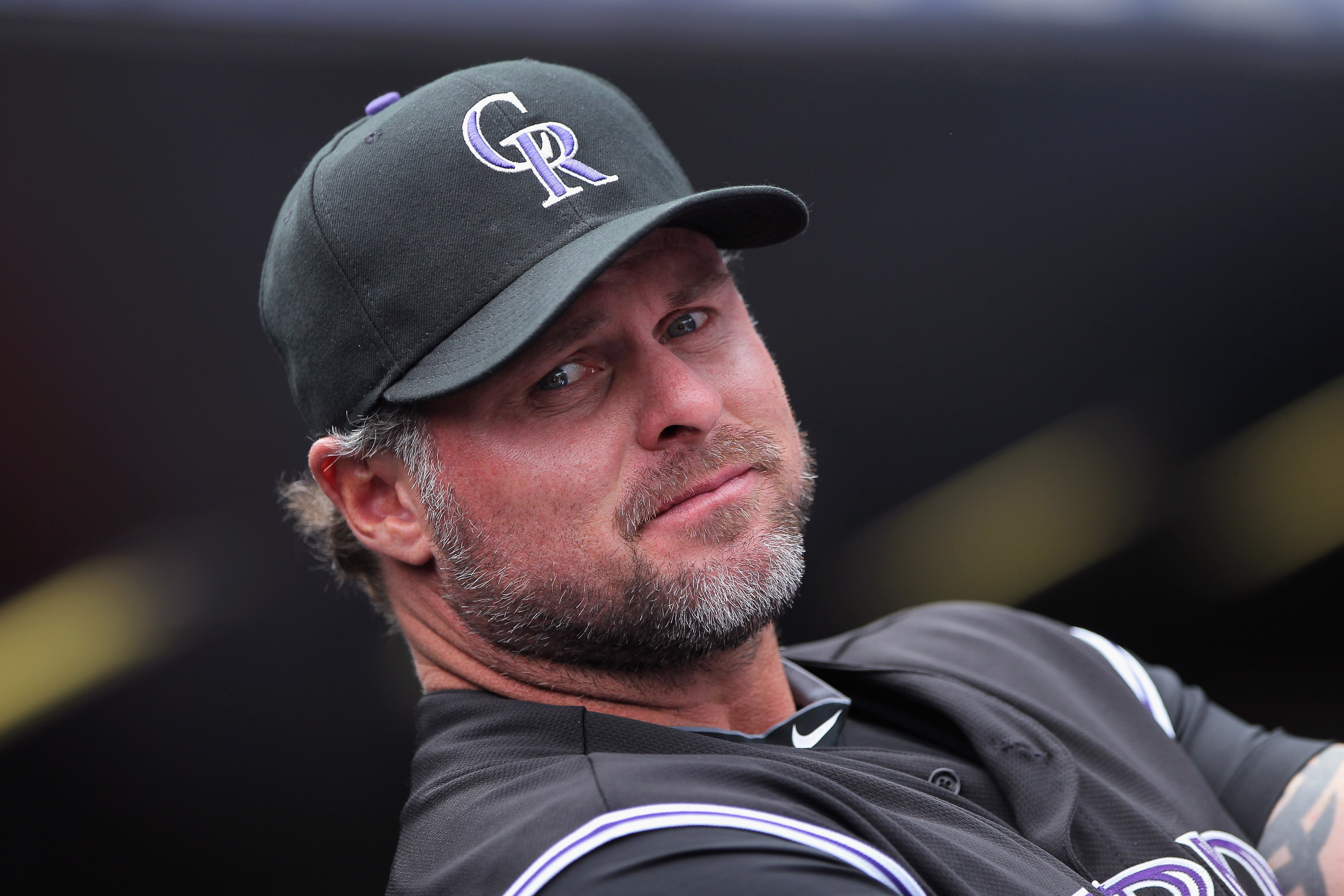DENVER, CO - APRIL 17:  Jason Giambi #23 of the Colorado Rockies looks on from the dugout prior to facing the Chicago Cubs at Coors Field on April 17, 2011 in Denver, Colorado.  (Photo by Doug Pensinger/Getty Images)