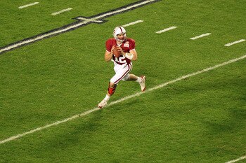 MIAMI, FL - JANUARY 03:  Quarterback Andrew Luck #12 of the Stanford Cardinal looks to pass as he rolls out of the pocket against the Virginia Tech Hokies during the 2011 Discover Orange Bowl at Sun Life Stadium on January 3, 2011 in Miami, Florida. Stanf