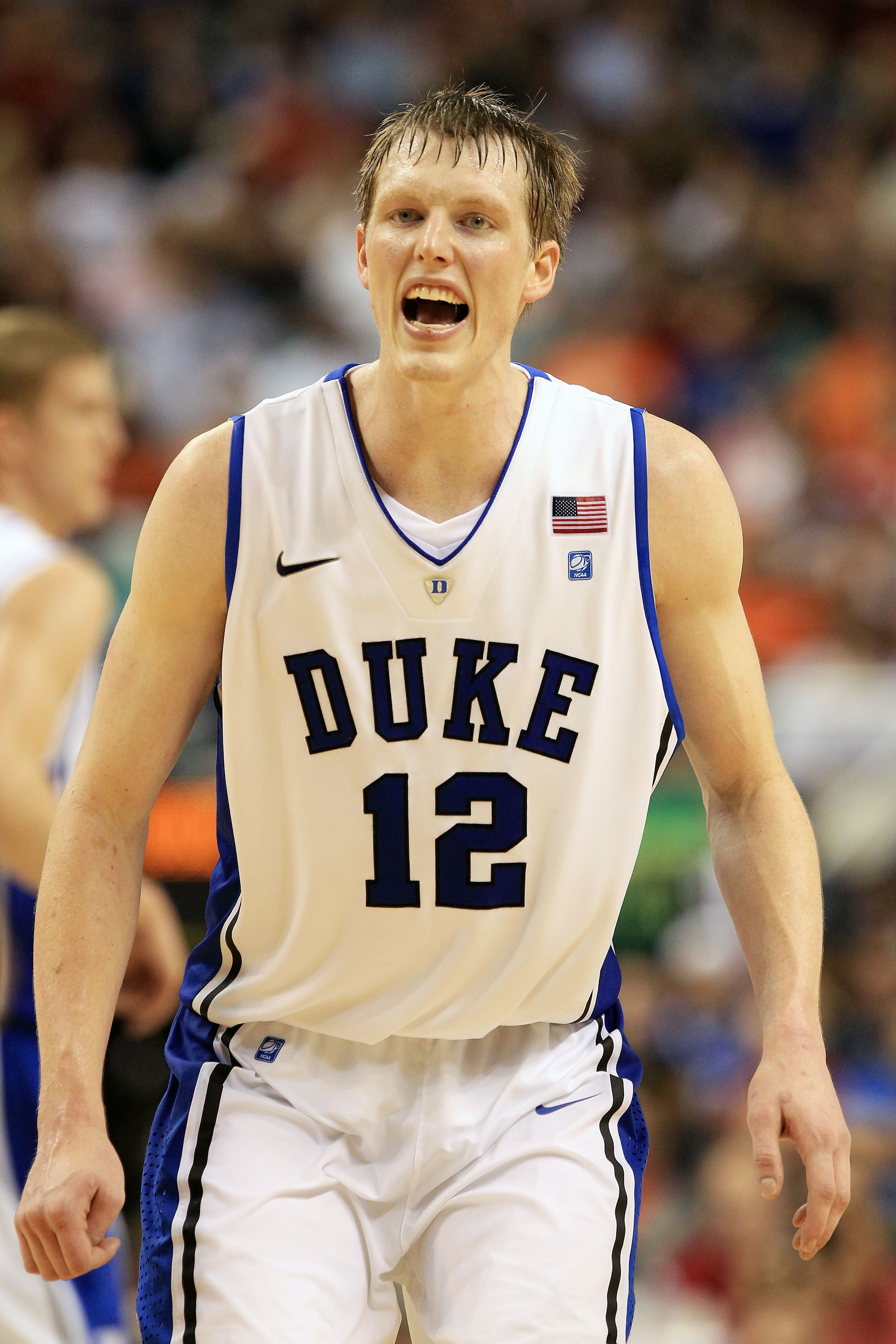 GREENSBORO, NC - MARCH 11:  Kyle Singler #12 of the Duke Blue Devils reacts during the second half against the Maryland Terrapins in the quarterfinals of the 2011 ACC men's basketball tournament at the Greensboro Coliseum on March 11, 2011 in Greensboro,