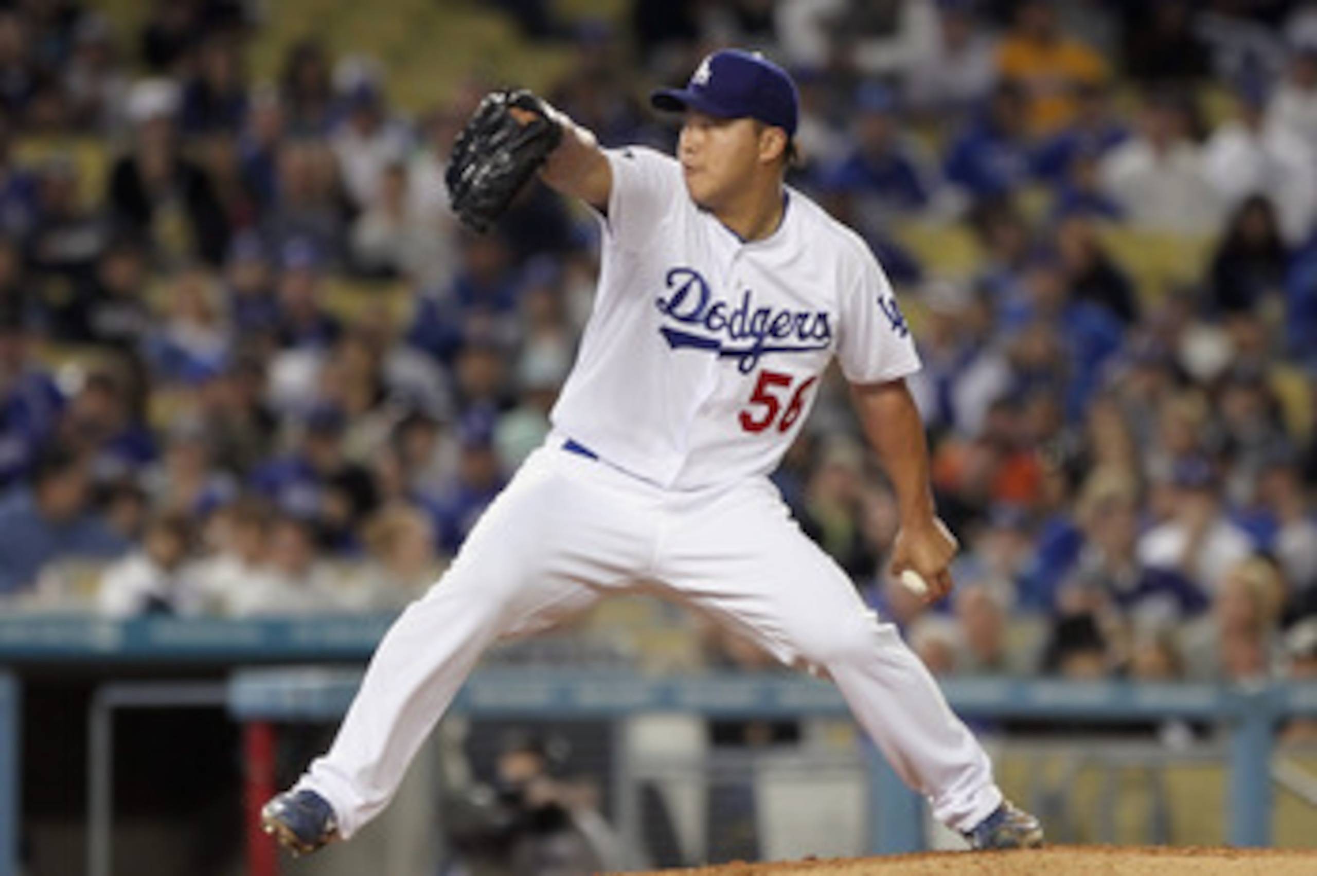 LOS ANGELES, CA - APRIL 03:  Hong-Chih Kuo #56 of the Los Angeles Dodgers pitches against the San Francisco Giants at Dodger Stadium on April 3, 2011 in Los Angeles, California.  (Photo by Jeff Gross/Getty Images)