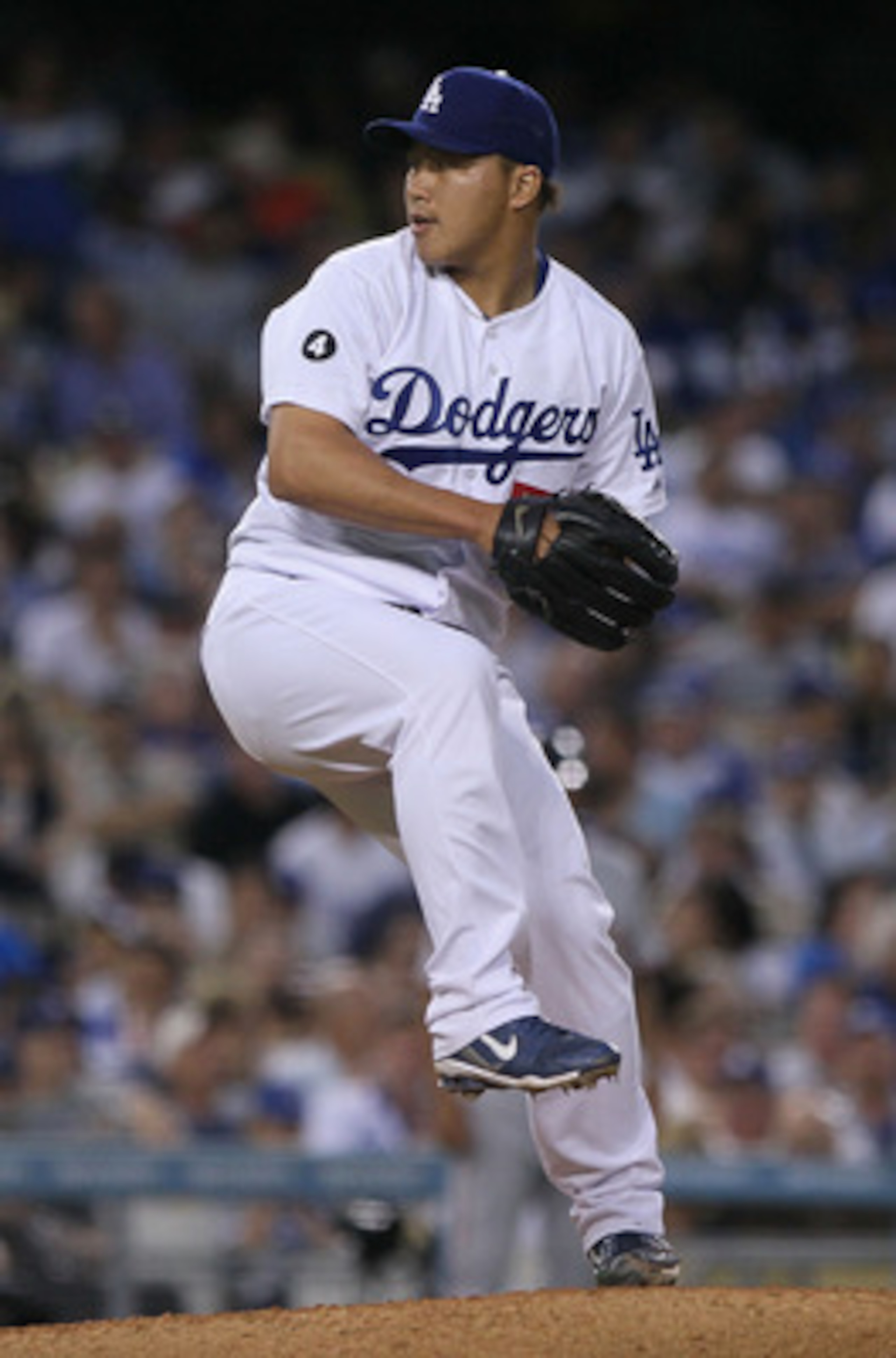 LOS ANGELES, CA - MARCH 31:  Hong-Chih Kuo #56 of the Los Angeles Dodgers throws a pitch against the San Francisco Giants in the eighth inning on Opening Day at Dodger Stadium on March 31, 2011 in Los Angeles, California.  (Photo by Jeff Gross/Getty Image