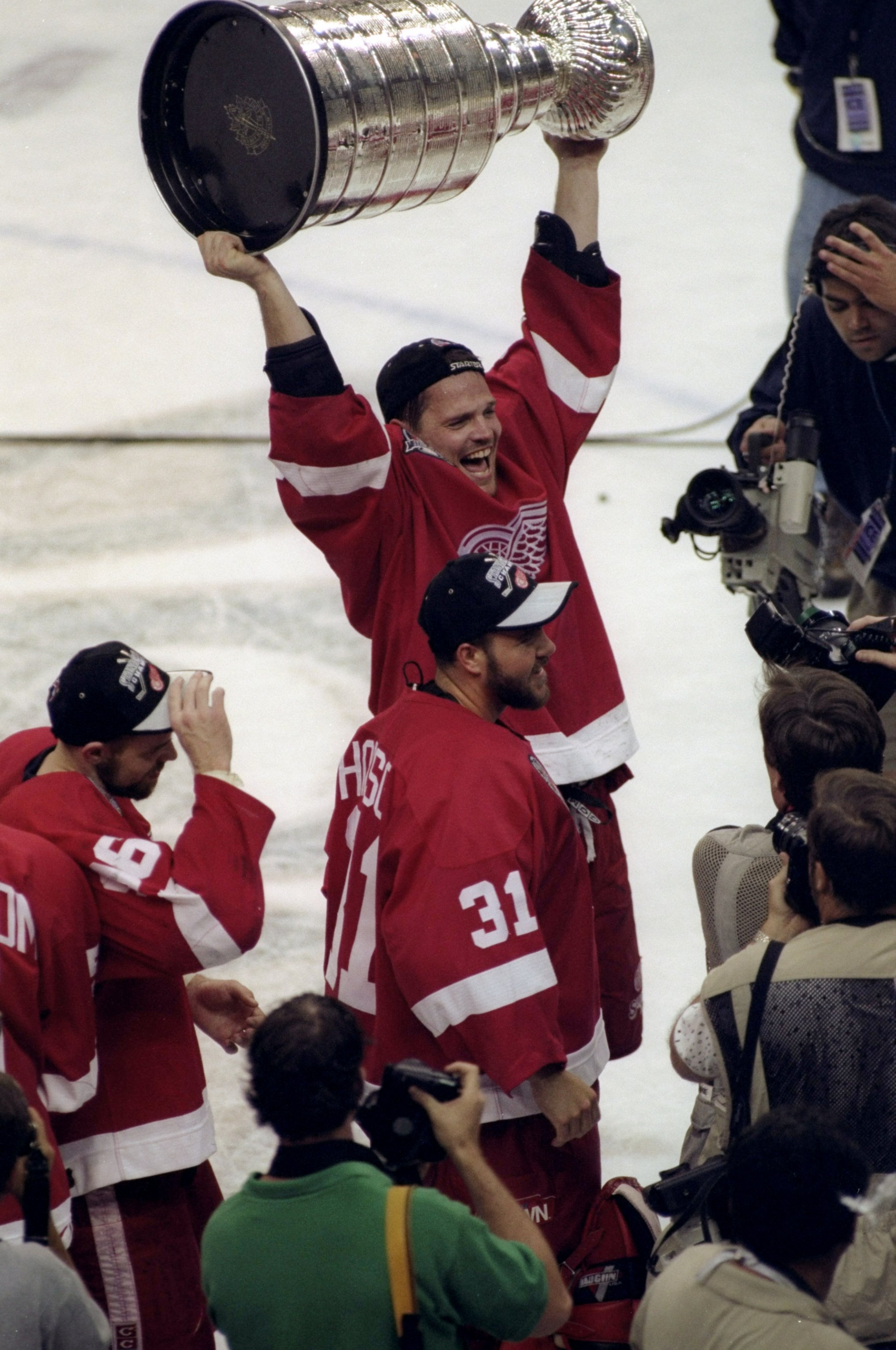 16 Jun 1998: Joe Kocur #26 of the Detroit Red Wings holds up the Stanley Cup during the Stanley Cup Finals game against the Washington Capitals at the MCI Center in Washington, D. C.. The Red Wings defeated the Capitals 4-1. Mandatory Credit: Craig Melvi 16 Jun 1998: Joe Kocur #26 of the Detroit Red Wings holds up the Stanley Cup during the Stanley Cup Finals game against the Washington Capitals at the MCI Center in Washington, D. C.. The Red Wings defeated the Capitals 4-1. Mandatory Credit: Craig Melvi