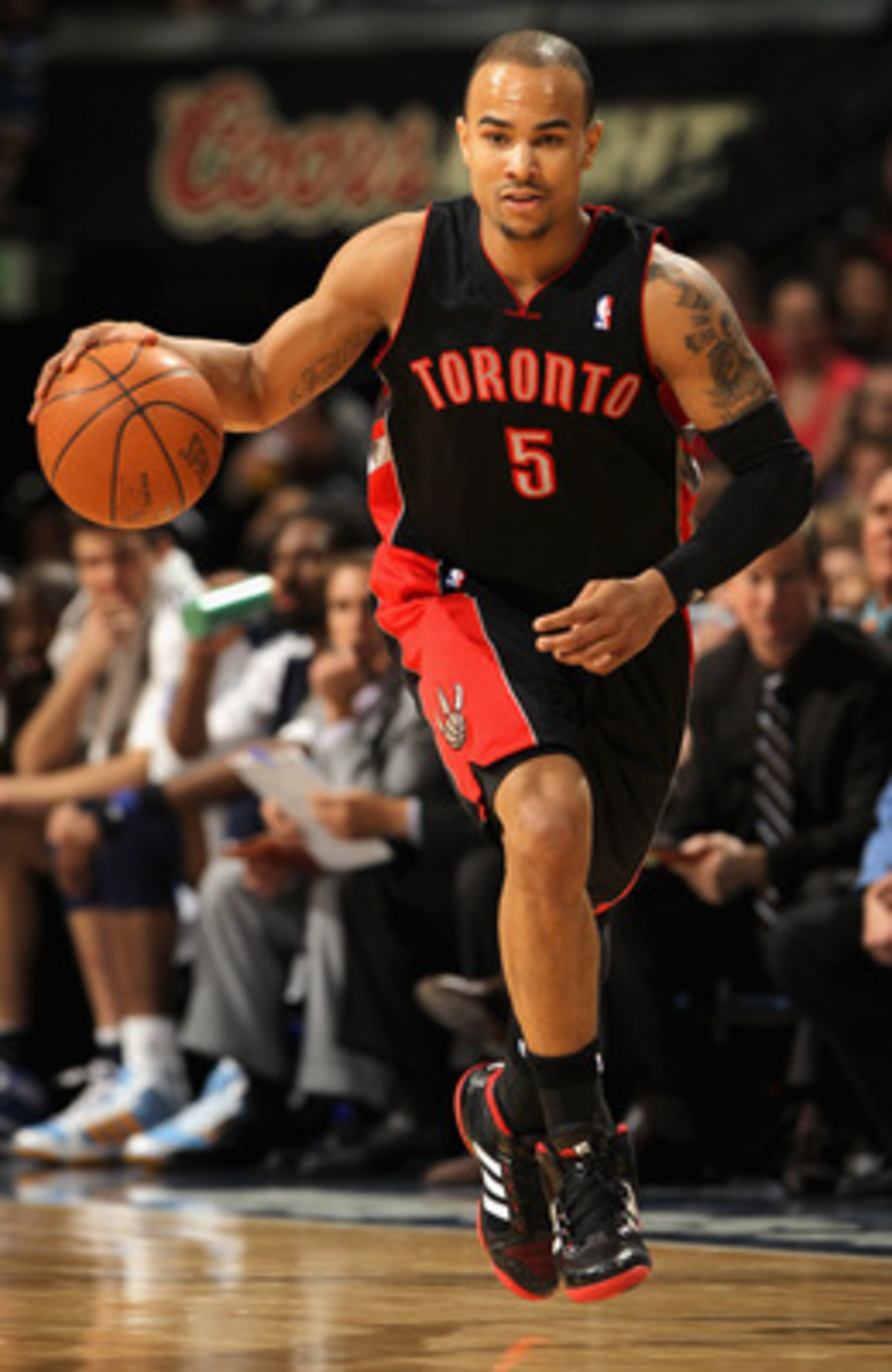 DENVER, CO - MARCH 21:  Jerryd Bayless #5 of the Toronto Raptors controls the ball against the Denver Nuggets at the Pepsi Center on March 21, 2011 in Denver, Colorado. The Nuggets defeated the Raptors 123-90. NOTE TO USER: User expressly acknowledges and