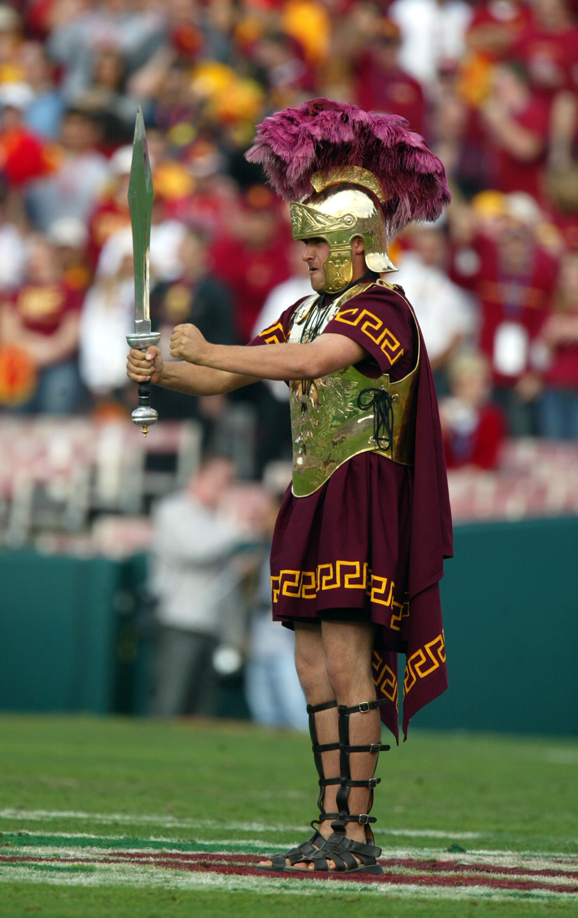 PASADENA, CA - JANUARY 1:  Tommy Trojan, mascot of the USC Trojans entertains the crowd during an intermission in the 2004 Rose Bowl game against the Michigan Wolverines on January 1, 2004 at the Rose Bowl in Pasadena, California.  USC defeated Michigan 2