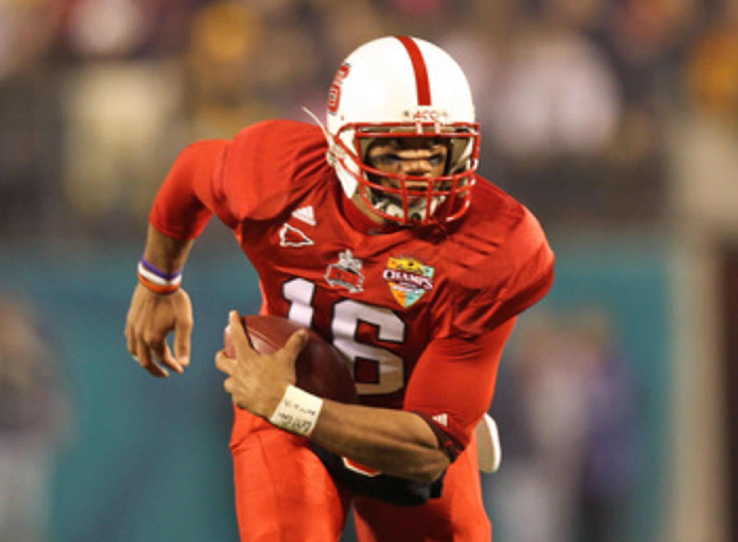ORLANDO, FL - DECEMBER 28: Russell Wilson #16 of the North Carolina State Wolfpack rushes with the ball during the Champs Sports Bowl against the West Virginia Mountineers at Florida Citrus Bowl Stadium on December 28, 2010 in Orlando, Florida. (Photo b ORLANDO, FL - DECEMBER 28: Russell Wilson #16 of the North Carolina State Wolfpack rushes with the ball during the Champs Sports Bowl against the West Virginia Mountineers at Florida Citrus Bowl Stadium on December 28, 2010 in Orlando, Florida. (Photo b
