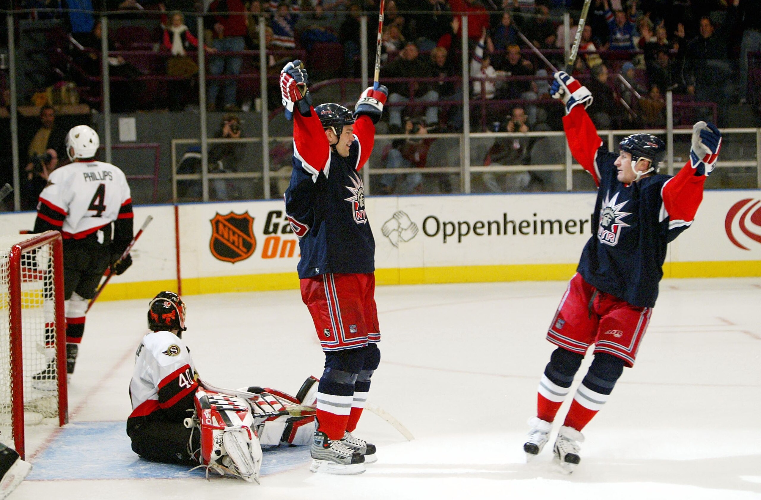 NEW YORK - FEBRUARY 16:  Bobby Holik #16 and Alex Kovalev #27 (right) of the New York Rangers celebrate  after Holik scored a goal against Patrick Lalime #40 of the Ottawa Senators on February 16, 2004 at Madison Square Garden in New York City.  (Photo by