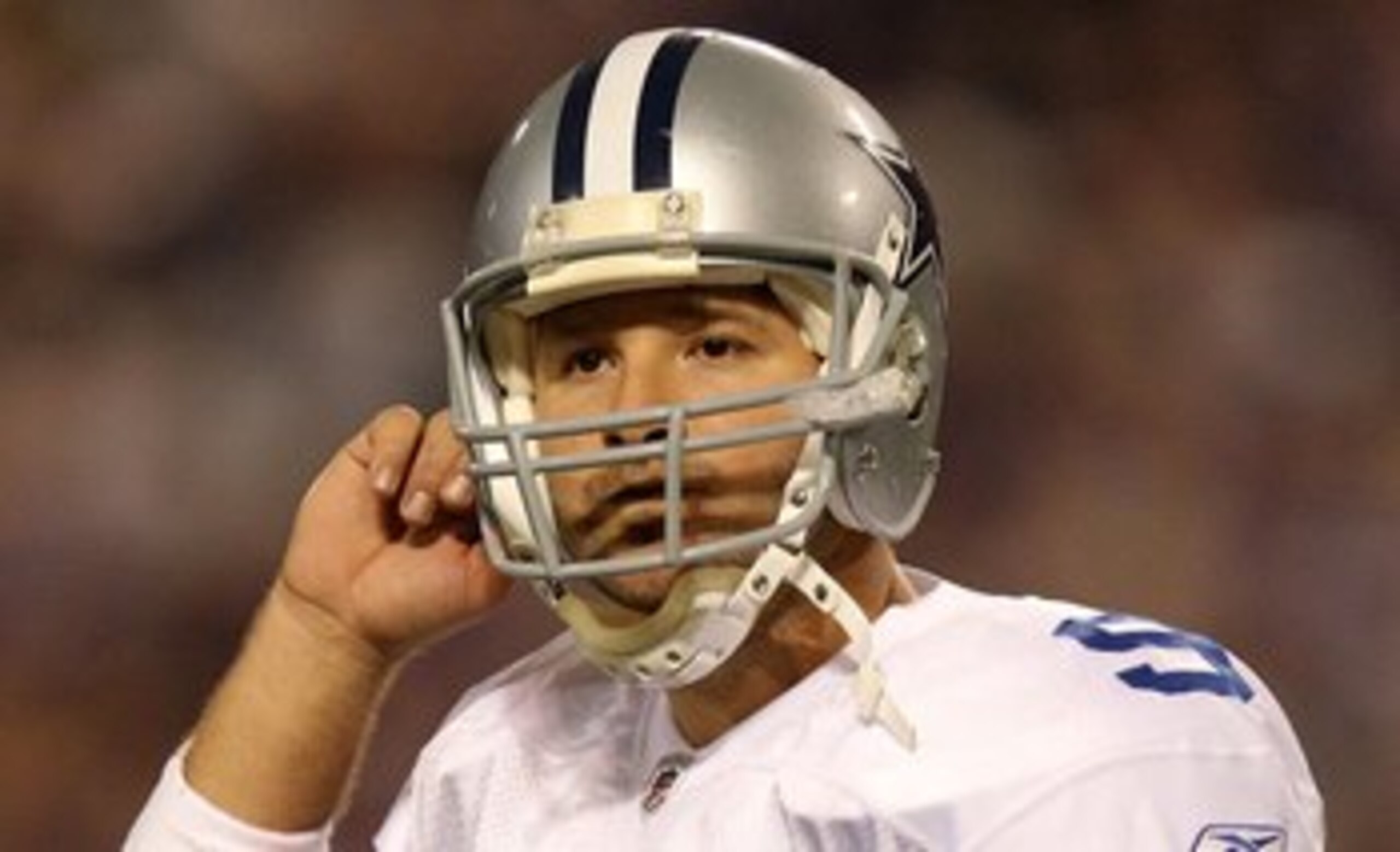MINNEAPOLIS - JANUARY 17: Tony Romo #9 of the Dallas Cowboys looks on during the game against the Minnesota Vikings during the NFC Divisional Playoff Game at Hubert H. Humphrey Metrodome on January 17, 2010 in Minneapolis, Minnesota. The Vikings defeated MINNEAPOLIS - JANUARY 17: Tony Romo #9 of the Dallas Cowboys looks on during the game against the Minnesota Vikings during the NFC Divisional Playoff Game at Hubert H. Humphrey Metrodome on January 17, 2010 in Minneapolis, Minnesota. The Vikings defeated