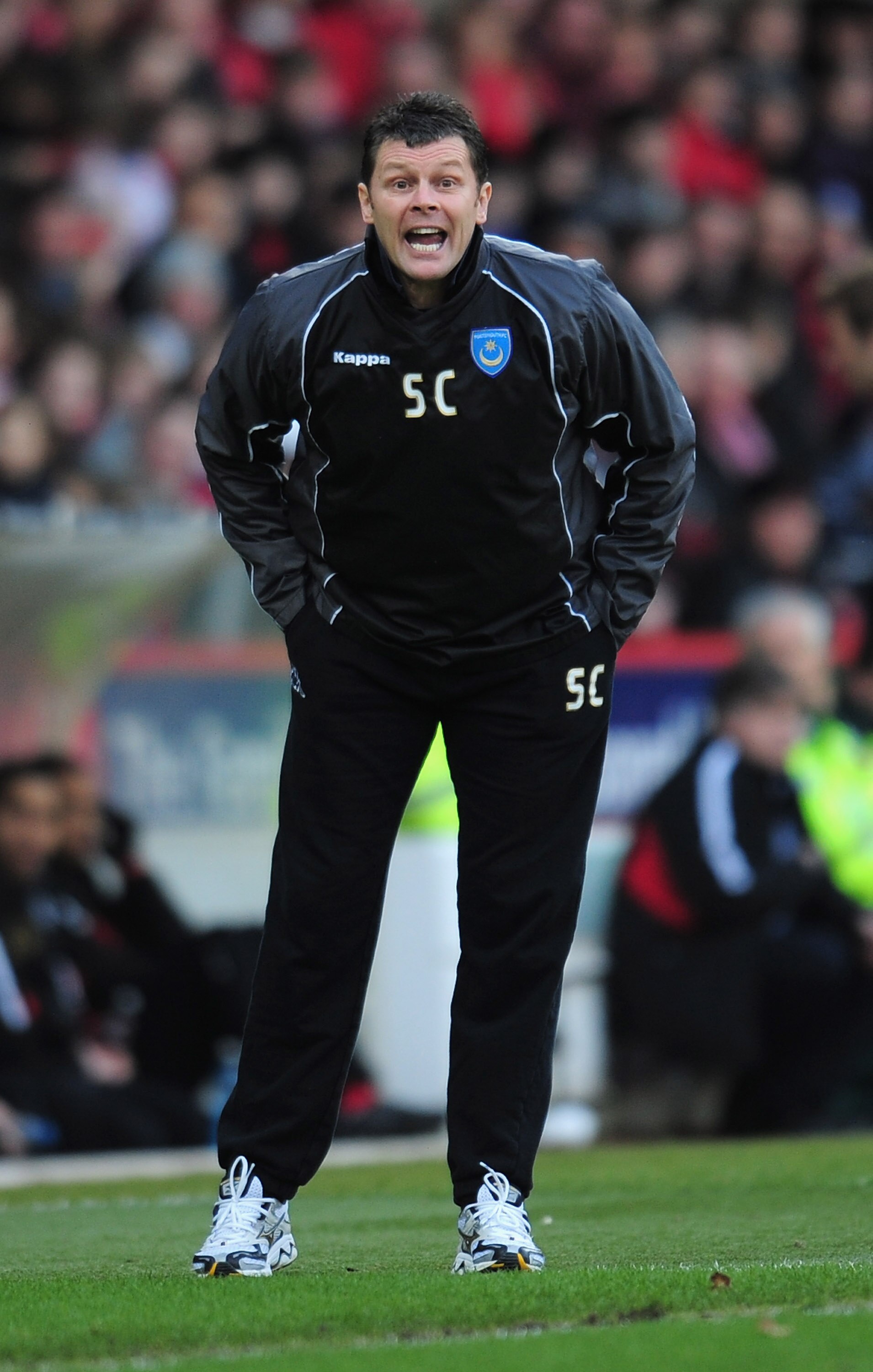 NOTTINGHAM, ENGLAND - JANUARY 15:  Steve Cotterill the Portsmouth coach shouts instructions during the npower Championship match between Nottingham Forest and Portsmouth at the City Ground on January 15, 2011 in Nottingham, England.  (Photo by Shaun Botte