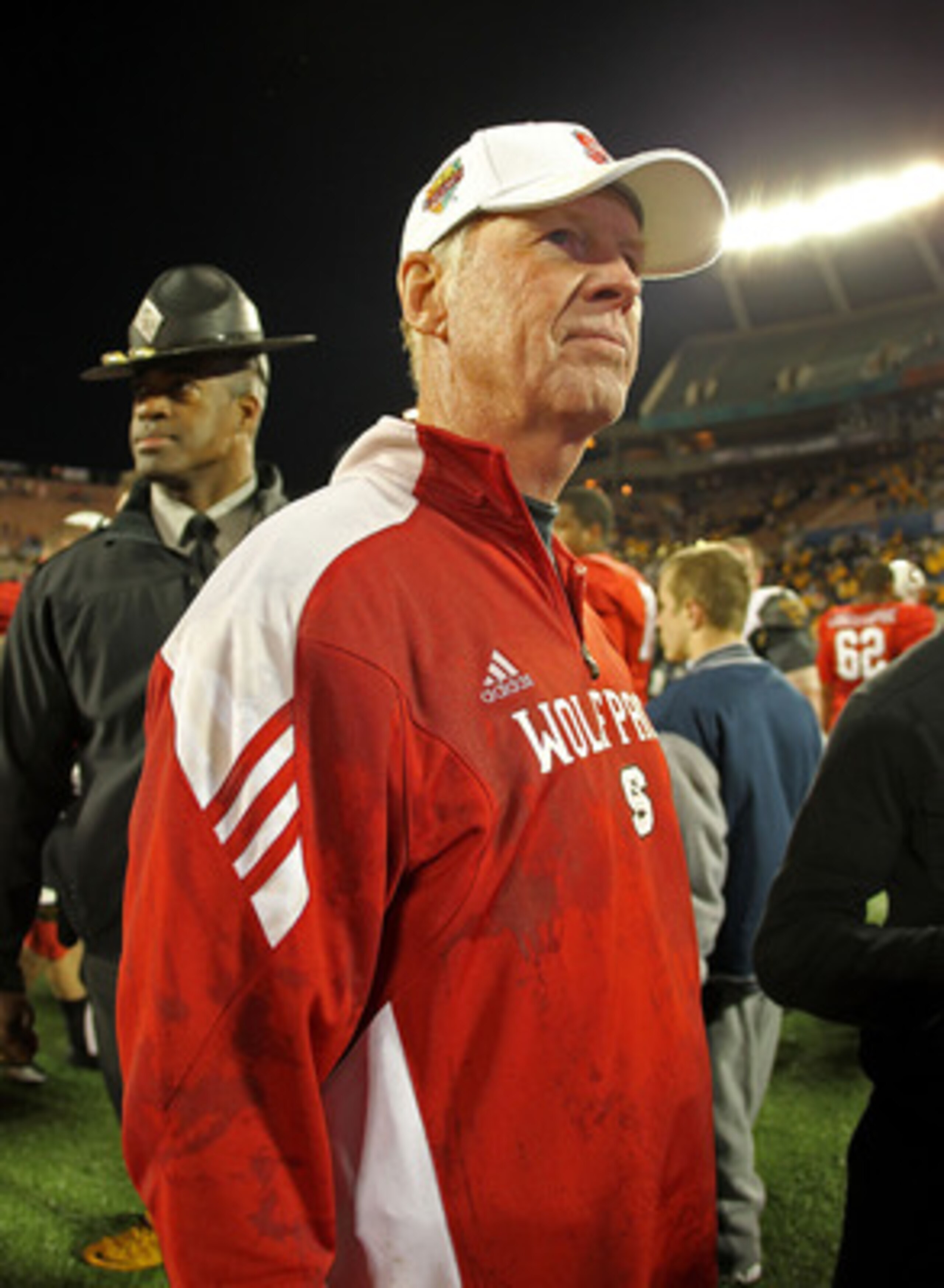 ORLANDO, FL - DECEMBER 28: North Carolina State Wolfpack head coach Tom O'Brien celebrates after winning the Champs Sports Bowl against the West Virginia Mountineers at Florida Citrus Bowl Stadium on December 28, 2010 in Orlando, Florida. (Photo by Mik ORLANDO, FL - DECEMBER 28: North Carolina State Wolfpack head coach Tom O'Brien celebrates after winning the Champs Sports Bowl against the West Virginia Mountineers at Florida Citrus Bowl Stadium on December 28, 2010 in Orlando, Florida. (Photo by Mik