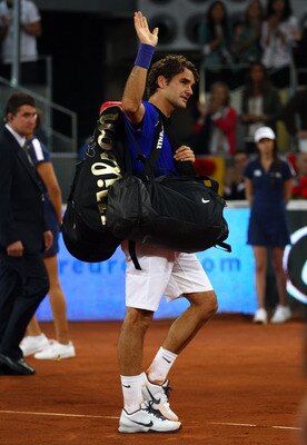 MADRID, SPAIN - MAY 07:  Roger Federer of Switzerland walks off court after losing Rafael Nadal of Spain during day eight of the Mutua Madrilena Madrid Open Tennis on May 7, 2011 in Madrid, Spain.  (Photo by Julian Finney/Getty Images)