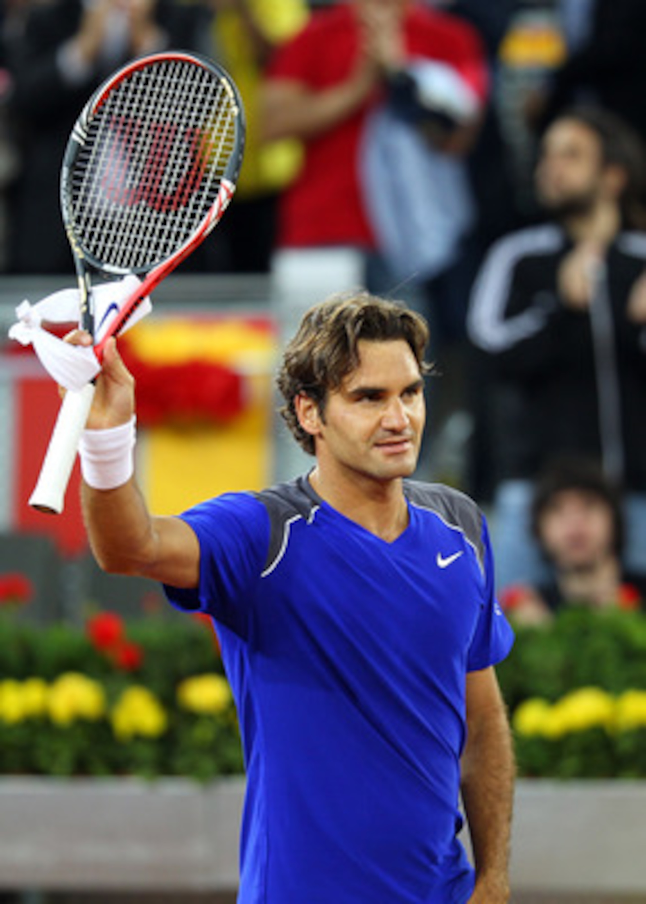 MADRID, SPAIN - MAY 04:  Roger Federer of Switzerland celebrates defeating Feliciano Lopez of Spain during day five of the Mutua Madrilena Madrid Open Tennis on May 4, 2011 in Madrid, Spain.  (Photo by Julian Finney/Getty Images)