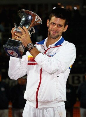 ROME, ITALY - MAY 15:  Novak Djokovic of Serbia holds the trophy aloft after his victory in the final against Rafael Nadal of Spain during day eight of the Internazoinali BNL D'Italia at the Foro Italico Tennis Centre on May 15, 2011 in Rome, Italy.  (Pho