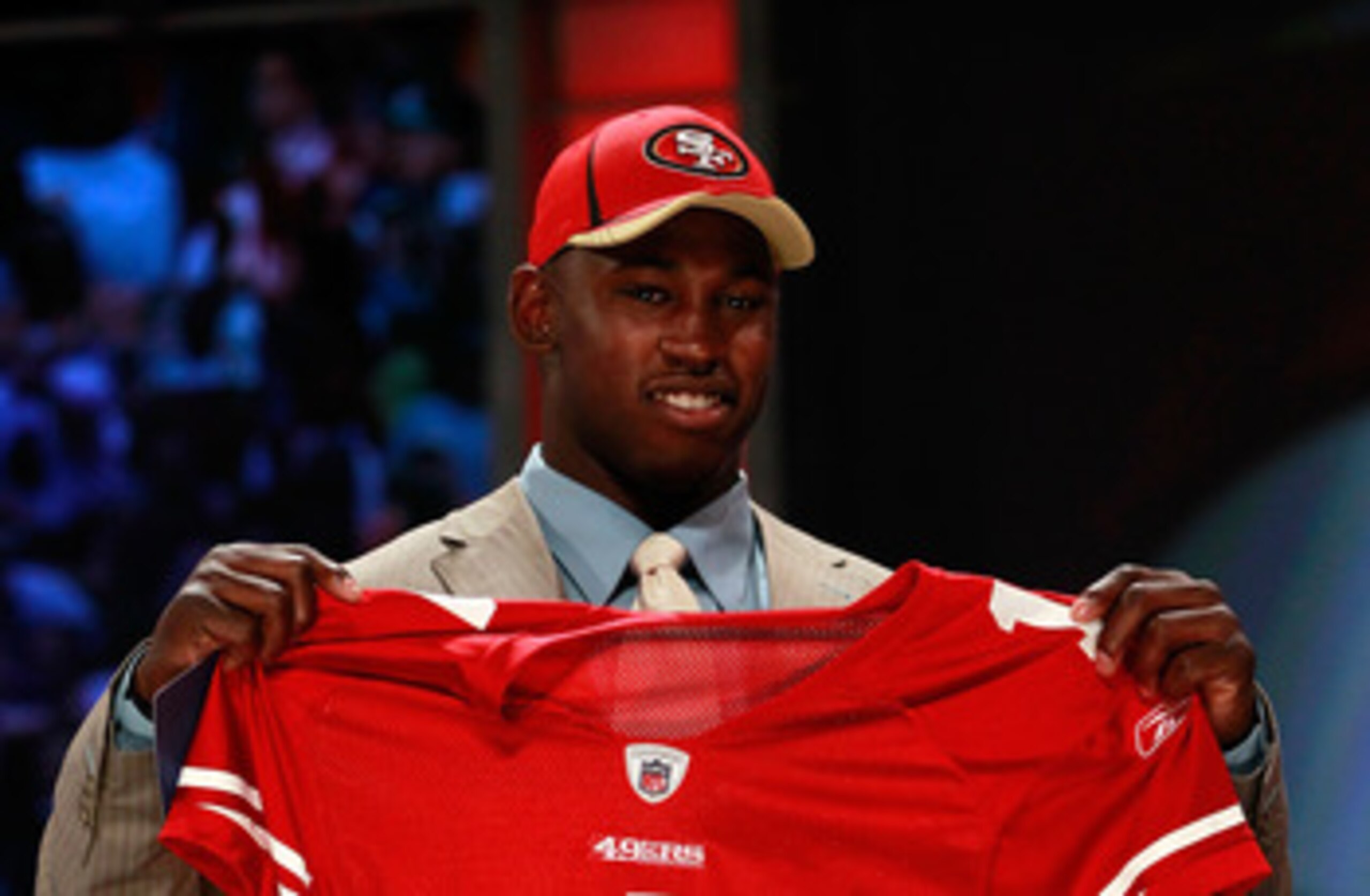 NEW YORK, NY - APRIL 28:  Aldon Smith, #7 overall pick by the San Francisco 49ers, holds up a jersey on stage during the 2011 NFL Draft at Radio City Music Hall on April 28, 2011 in New York City.  (Photo by Chris Trotman/Getty Images)