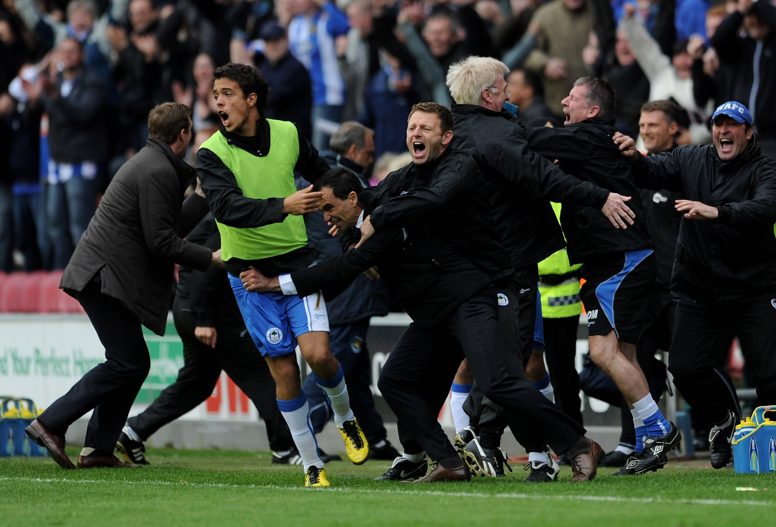 WIGAN, ENGLAND - MAY 15:  Wigan Athletic Manager Roberto Martinez celebrates after Charles N'Zogbia scored his team's third goal during the Barclays Premier League match between Wigan Athletic and West Ham United at the DW Stadium on May 15, 2011 in Wigan