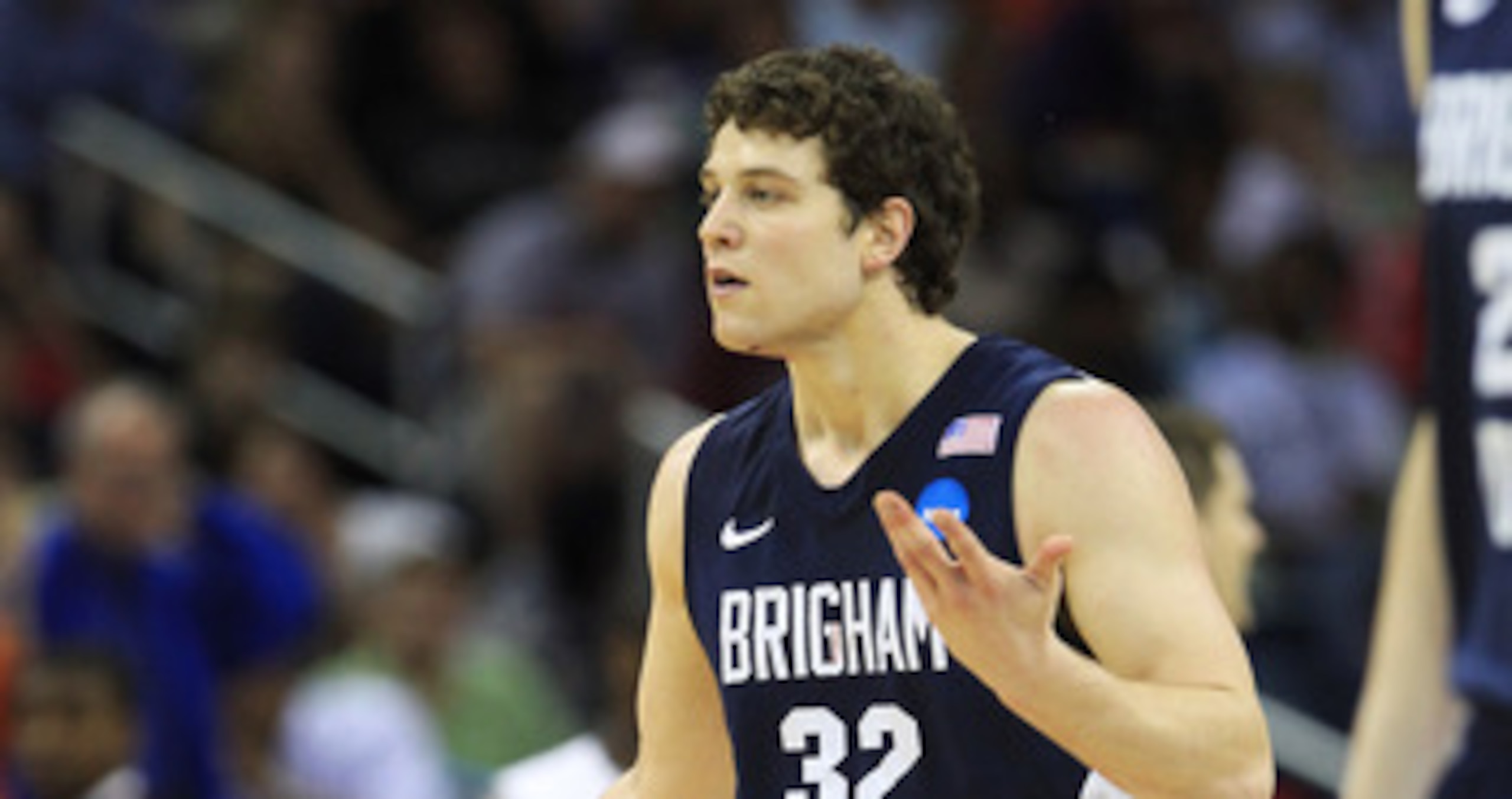 NEW ORLEANS, LA - MARCH 24:  Jimmer Fredette #32 of the Brigham Young Cougars reacts after being injured during their game against the Florida Gators in the Southeast regional of the 2011 NCAA men's basketball tournament at New Orleans Arena on March 24,