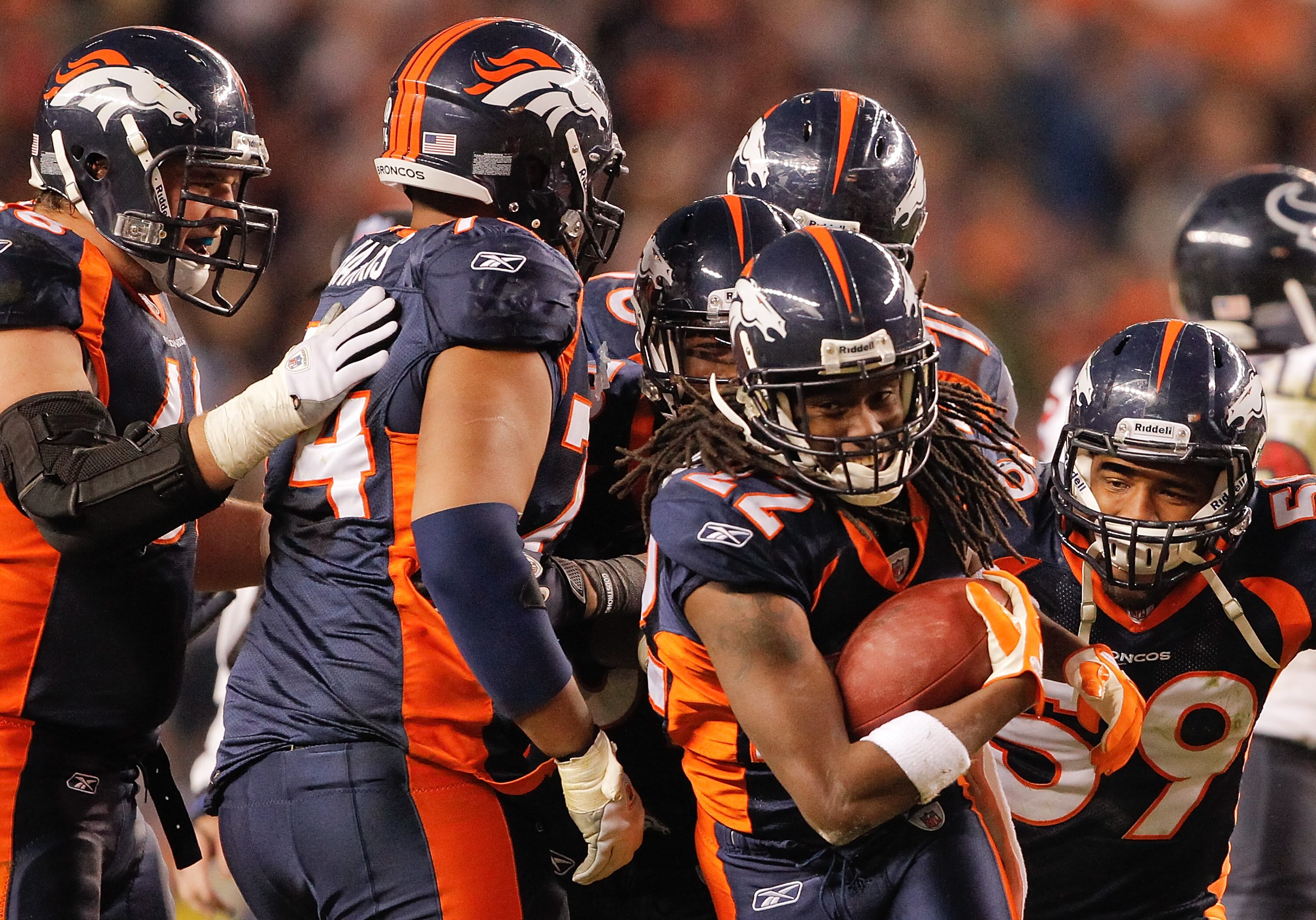 DENVER - DECEMBER 26:  Cornerback Syd'Quan Thompson #22 of the Denver Broncos celebrates an interception with teammates late in the fourth quarter agains the Houston Texans at INVESCO Field at Mile High on December 26, 2010 in Denver, Colorado. The Denver