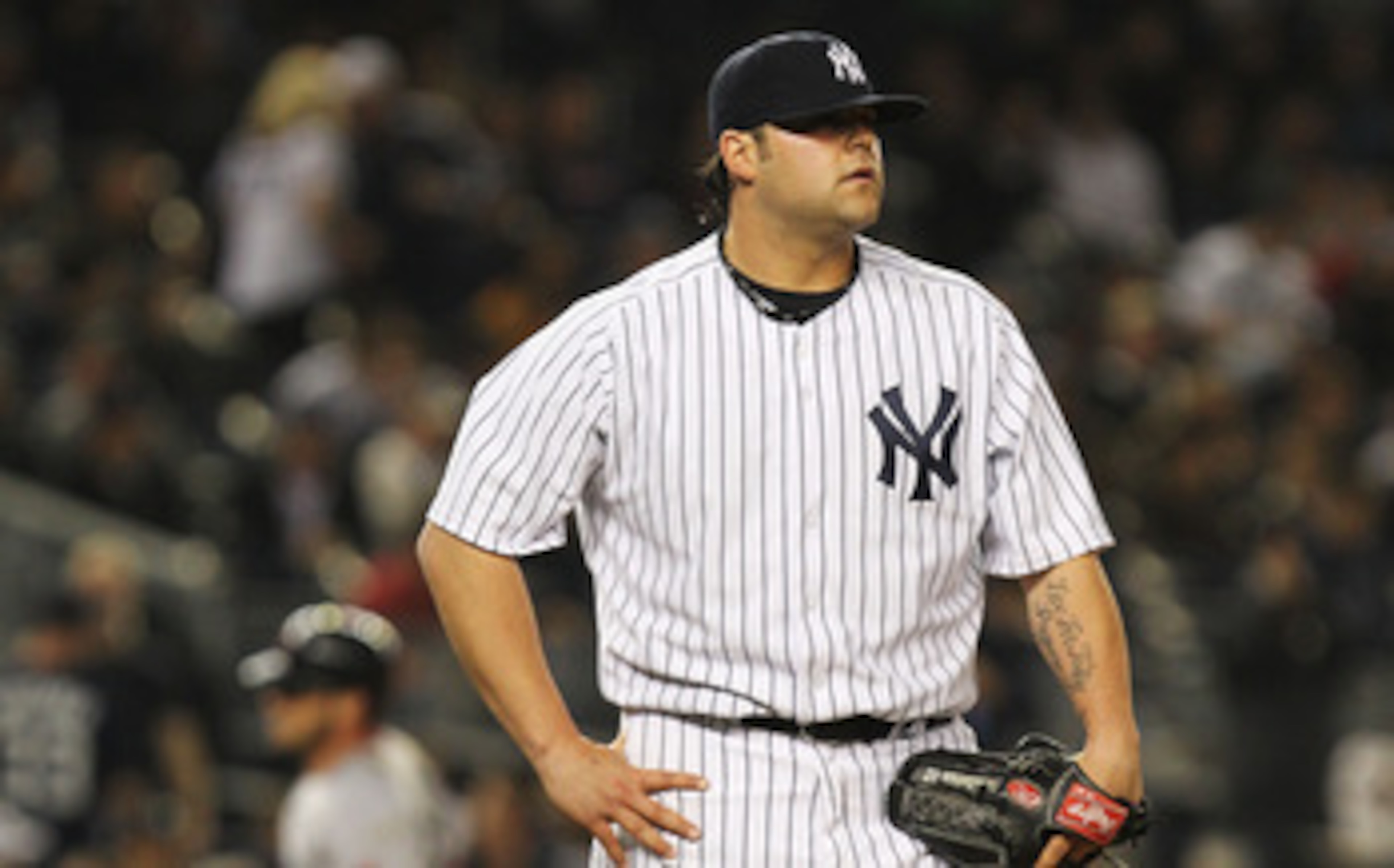 NEW YORK, NY - MAY 15:  Joba Chamberlain #62 of the New York Yankees reacts after giving up a home run against Jarrod Saltalamacchia #39 of the Boston Red Sox during their game on May 15, 2011 at Yankee Stadium in the Bronx borough of New York City.  (Pho