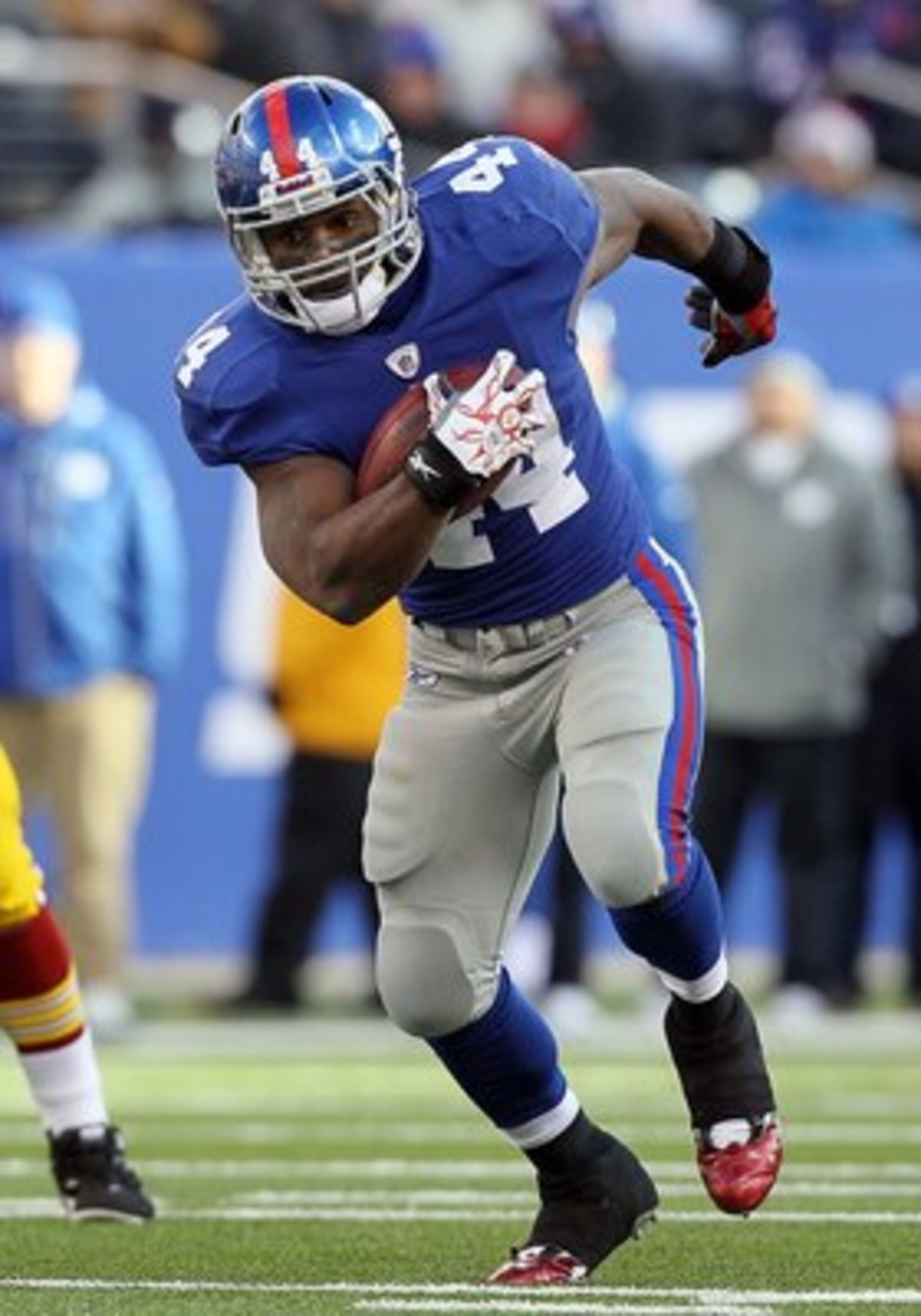 EAST RUTHERFORD, NJ - DECEMBER 05:  Ahmad Bradshaw #44 of the New York Giants runs the ball against the Washington Redskins on December 5, 2010 at the New Meadowlands Stadium in East Rutherford, New Jersey. The Giants defeated the Redskins 31-7.  (Photo b