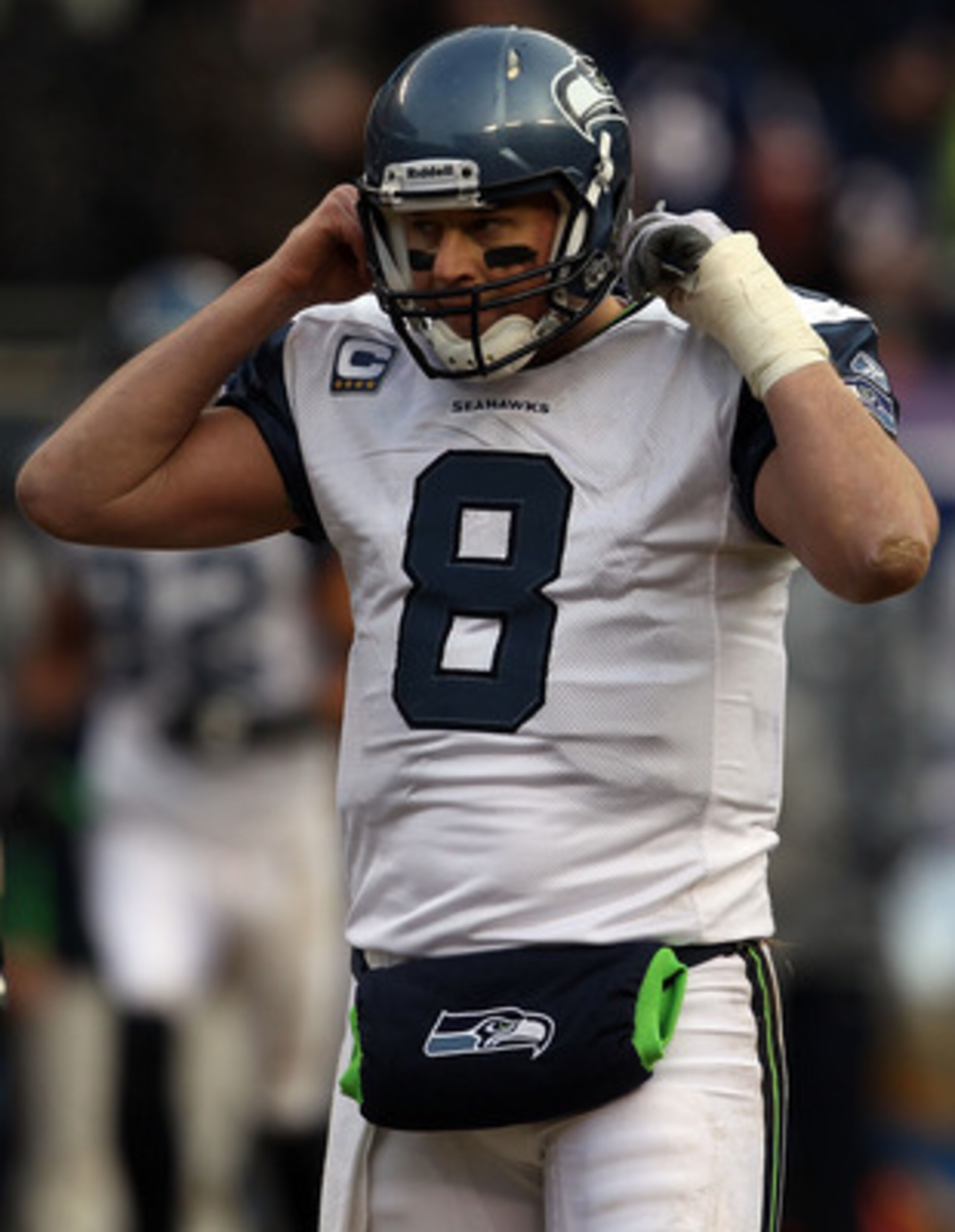 CHICAGO, IL - JANUARY 16:  Quarterback Matt Hasselbeck #8 of the Seattle Seahawks reacts while taking on the Chicago Bears in the 2011 NFC divisional playoff game at Soldier Field on January 16, 2011 in Chicago, Illinois.  (Photo by Jonathan Daniel/Getty 