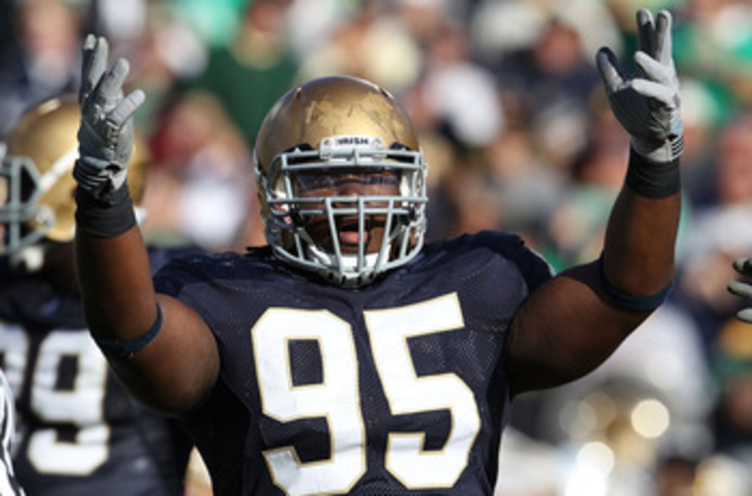 SOUTH BEND, IN - SEPTEMBER 04: Ian Williams #95 of the Notre Dame Fighting Irish encourages the crowd during a game against the Purdue Boilermakers at Notre Dame Stadium on September 4, 2010 in South Bend, Indiana. Notre Dame defeated Purdue 23-12. (Photo