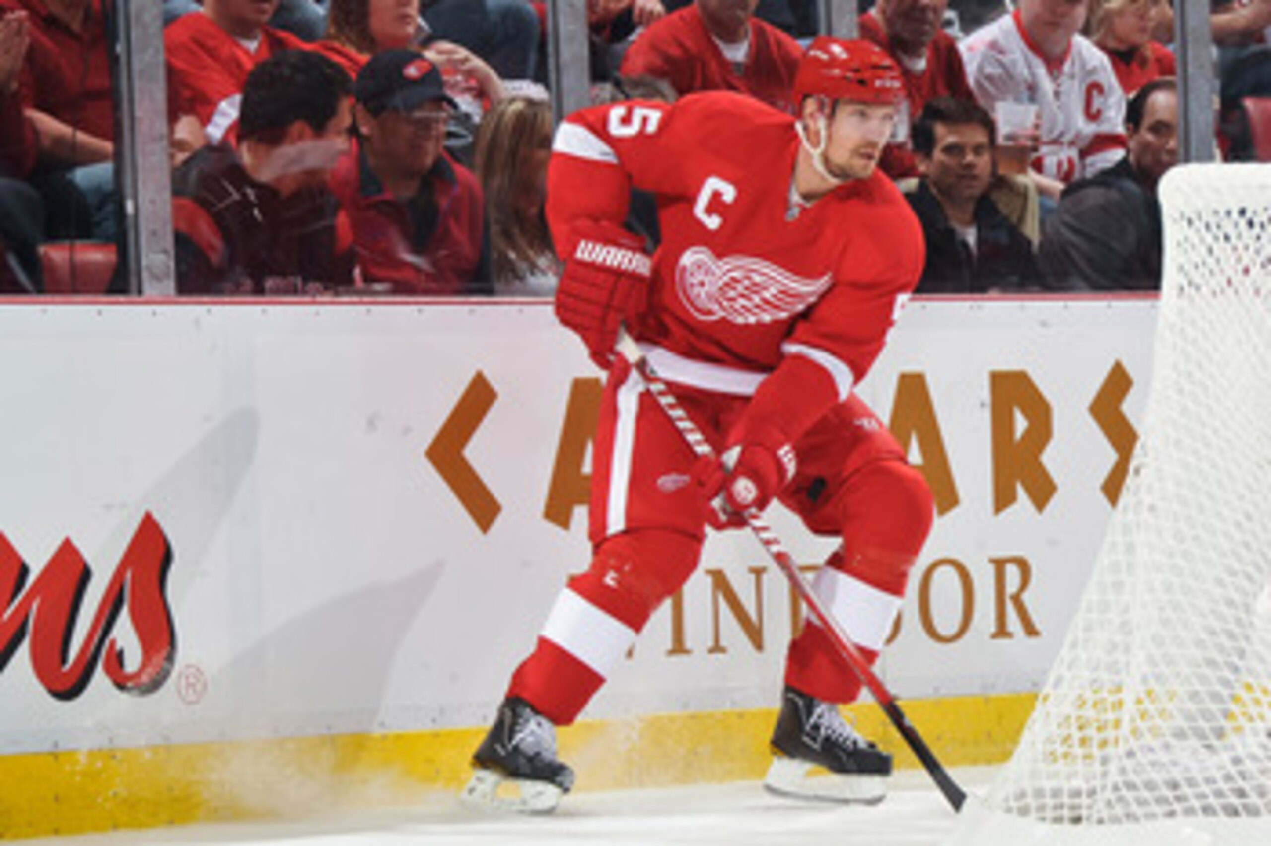 DETROIT - MAY 4: Nicklas Lidstrom #5 of the Detroit Red Wings skates with the puck against the San Jose Sharks in Game Three of the Western Conference Semifinals during the 2011 NHL Stanley Cup Playoffs on May 4, 2011 at Joe Louis Arena in Detroit, Michig