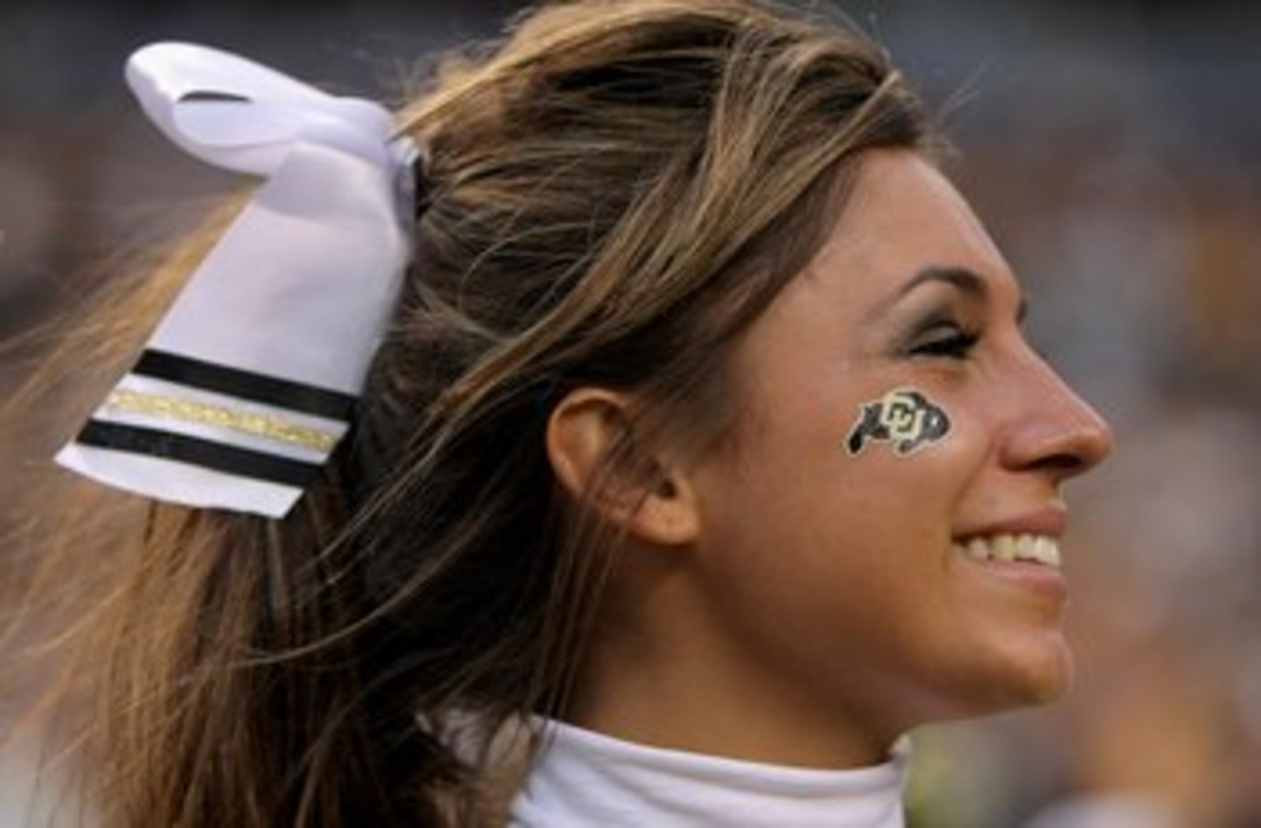 DENVER - AUGUST 31:  A University of Colorado Buffaloes cheerleader supports her team against the Colorado State University Rams at Invesco Field at Mile High on August 31, 2008 in Denver, Colorado. Colorado defeated Colorado State 38-17 to win the Centen