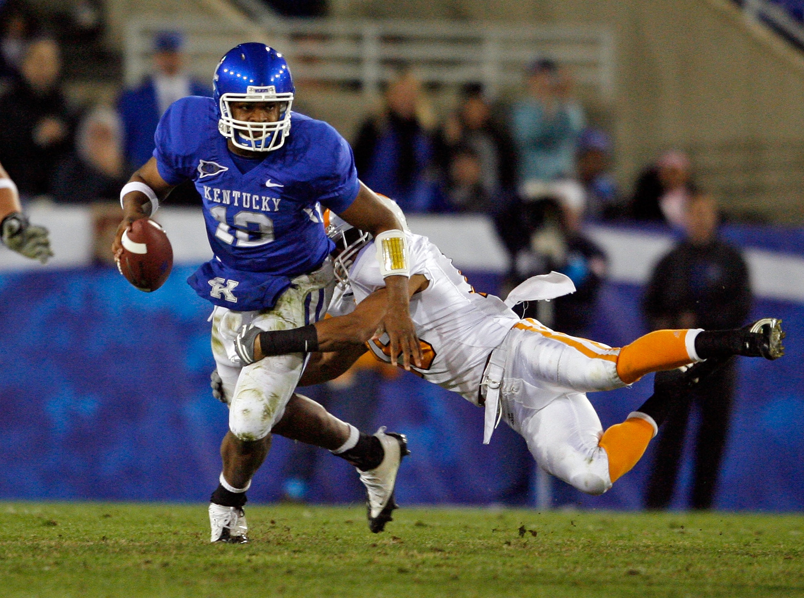 LEXINGTON, KY - NOVEMBER 28:  Morgan Newton #12 of the Kentucky Wildcats is tackled by Janzen Jackson #15 of the Tennessee Volunteers during the SEC game at Commonwealth Stadium on November 28, 2009 in Lexington, Kentucky.  (Photo by Andy Lyons/Getty Imag