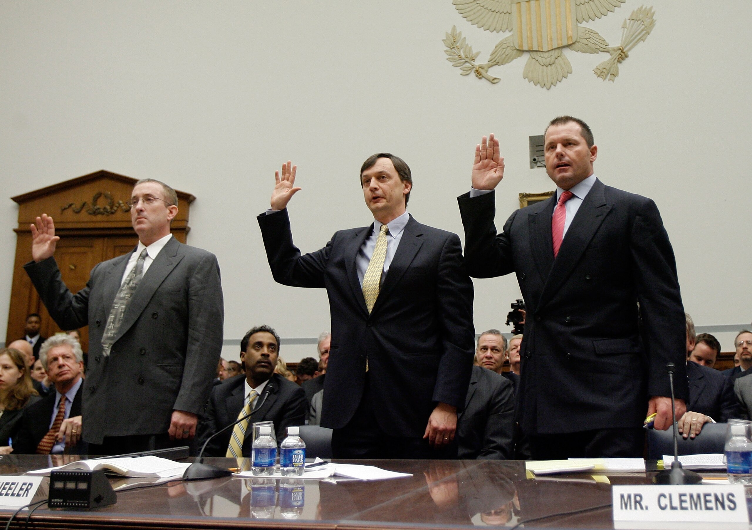 WASHINGTON - FEBRUARY 13:  (L-R) Brian McNamee, former personal trainer, Charlie Scheeler, member of the investigating staff for the Mitchell report and Major League Baseball player Roger Clemens raise their right hands as they are sworn in during a House