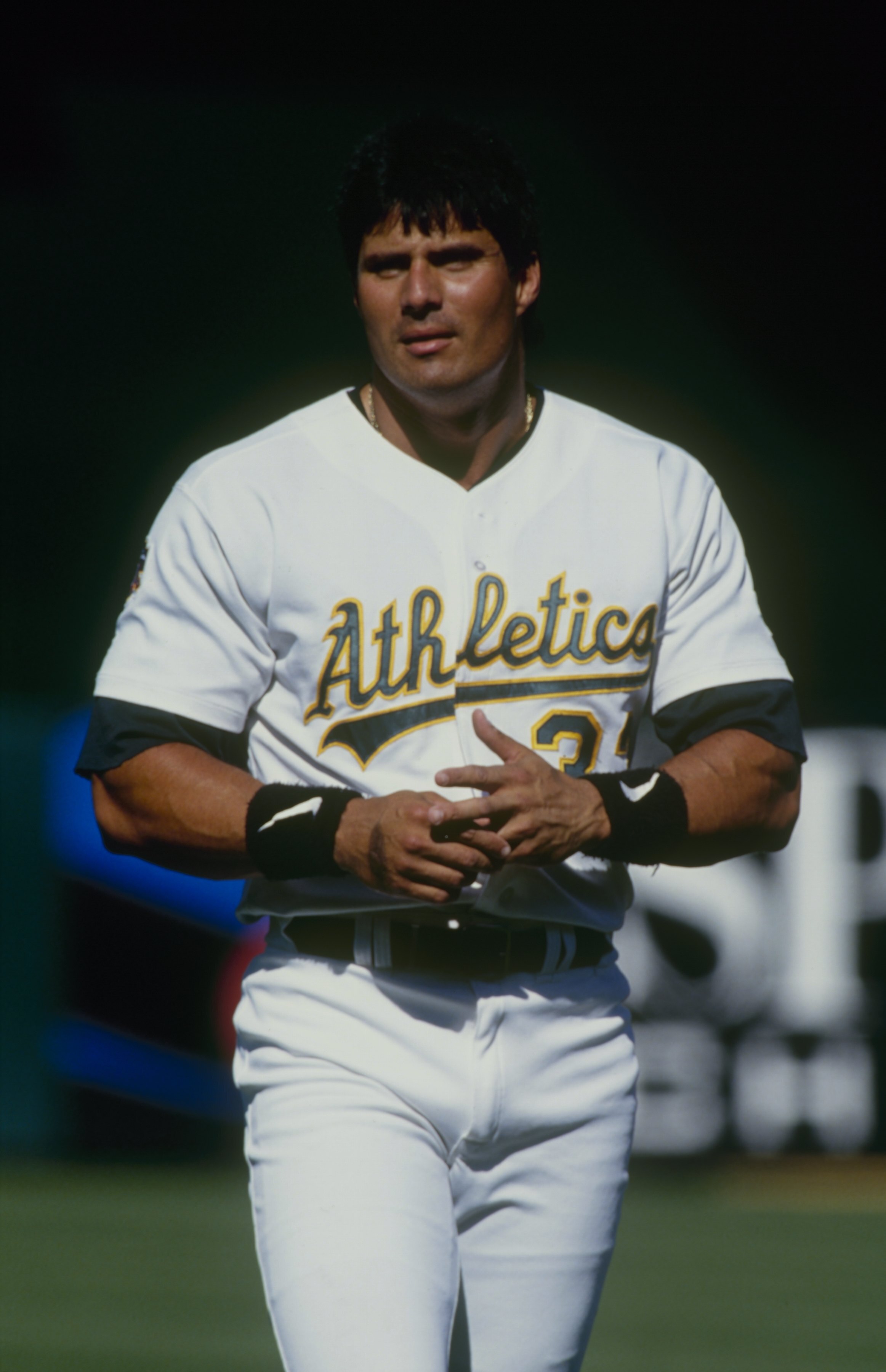 OAKLAND, CA - JUNE 29:  Jose Canseco of the Oakland Athletics looks on during the game against the Texas Rangers at Oakland-Alameda County Coliseum on June 29, 1997 in Oakland, California. (Photo by Otto Greule Jr/Getty Images)
