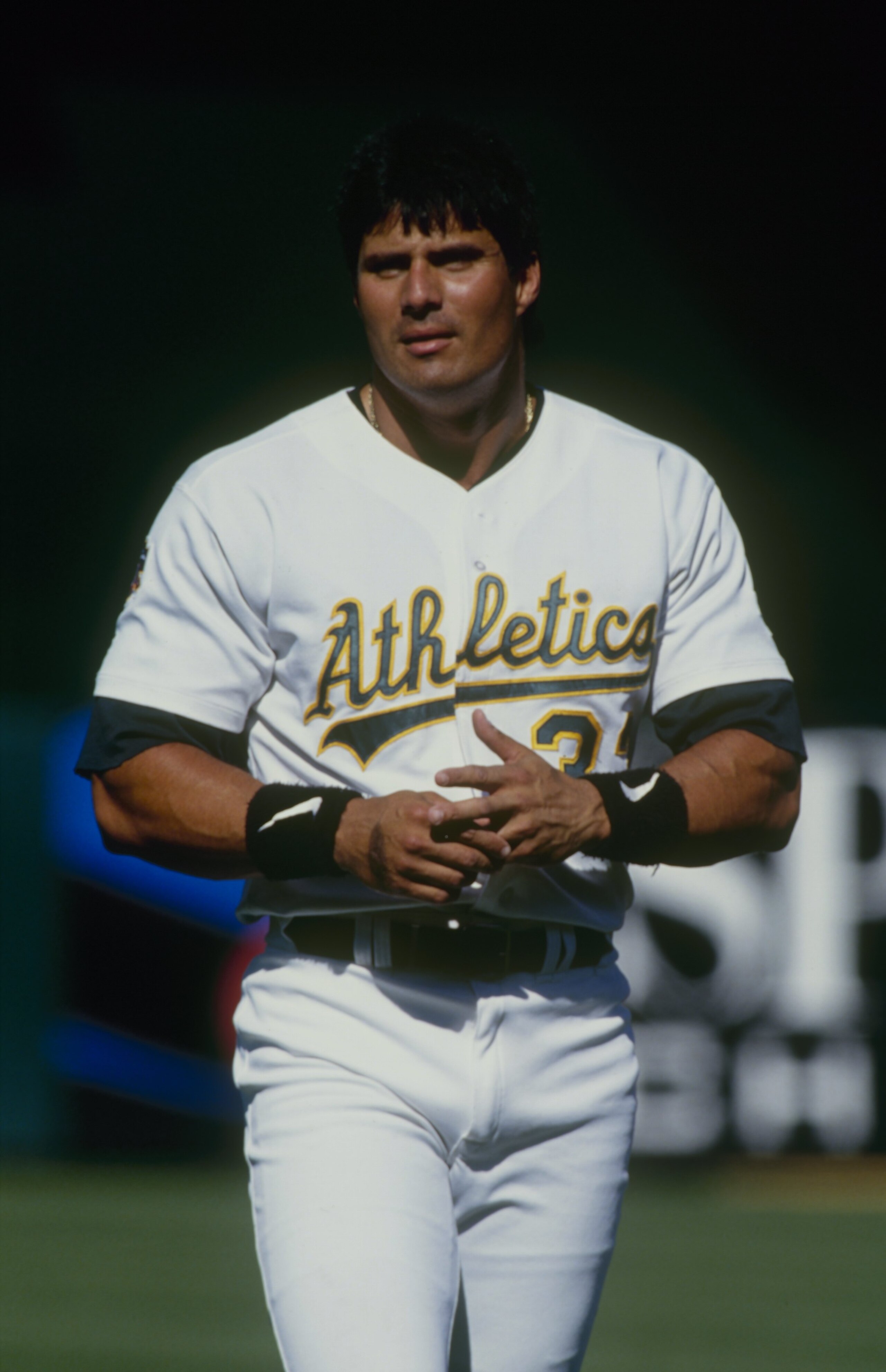 OAKLAND, CA - JUNE 29:  Jose Canseco of the Oakland Athletics looks on during the game against the Texas Rangers at Oakland-Alameda County Coliseum on June 29, 1997 in Oakland, California. (Photo by Otto Greule Jr/Getty Images)