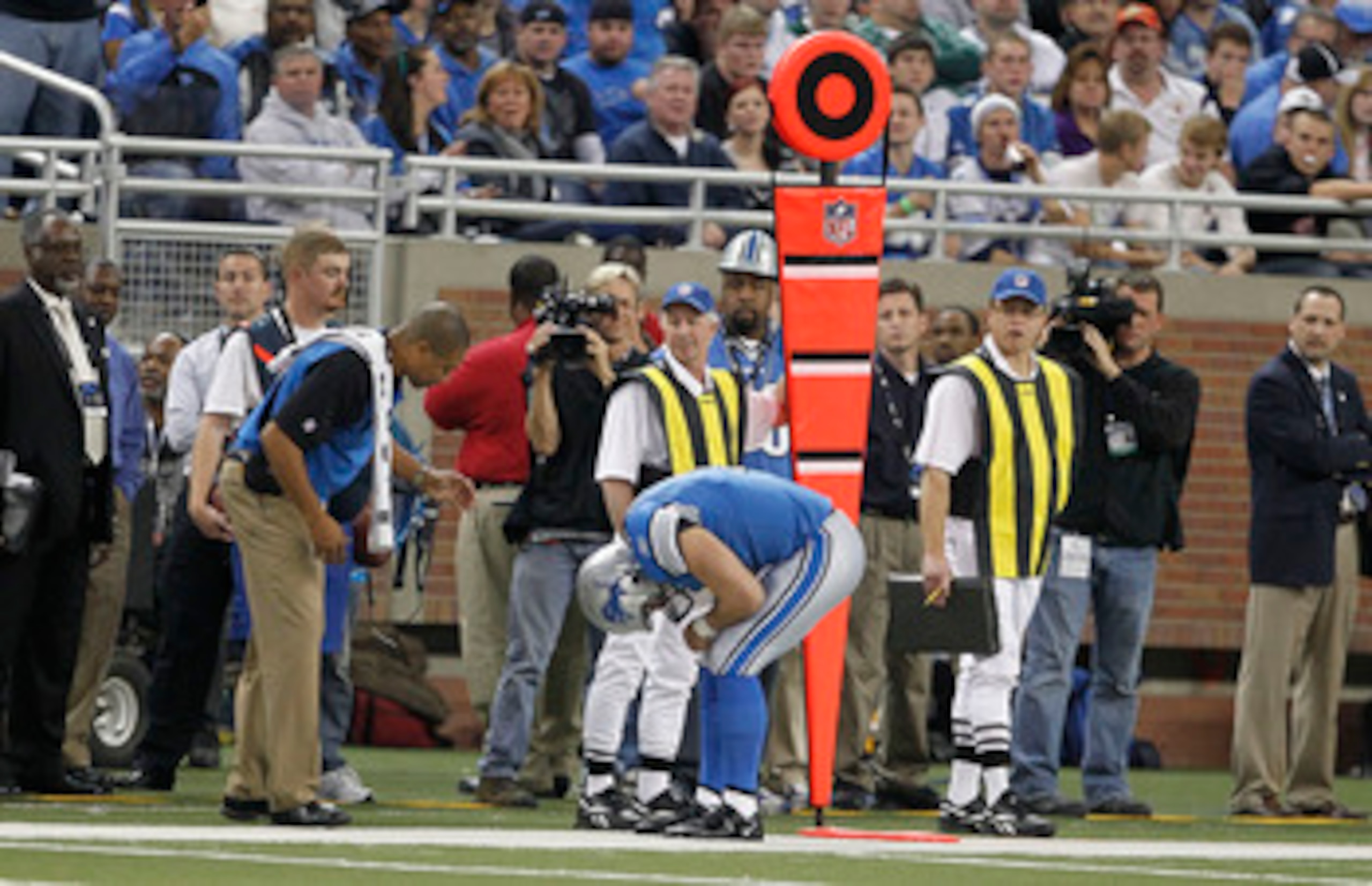 DETROIT - NOVEMBER 07:  Matthew Stafford #9 of the Detroit Lions bends over in pain against the New York Jets during the third quarter of the game at Ford Field on November 7, 2010 in Detroit, Michigan. The Jets defeated the Lions 23-20 in overtime.  (Pho