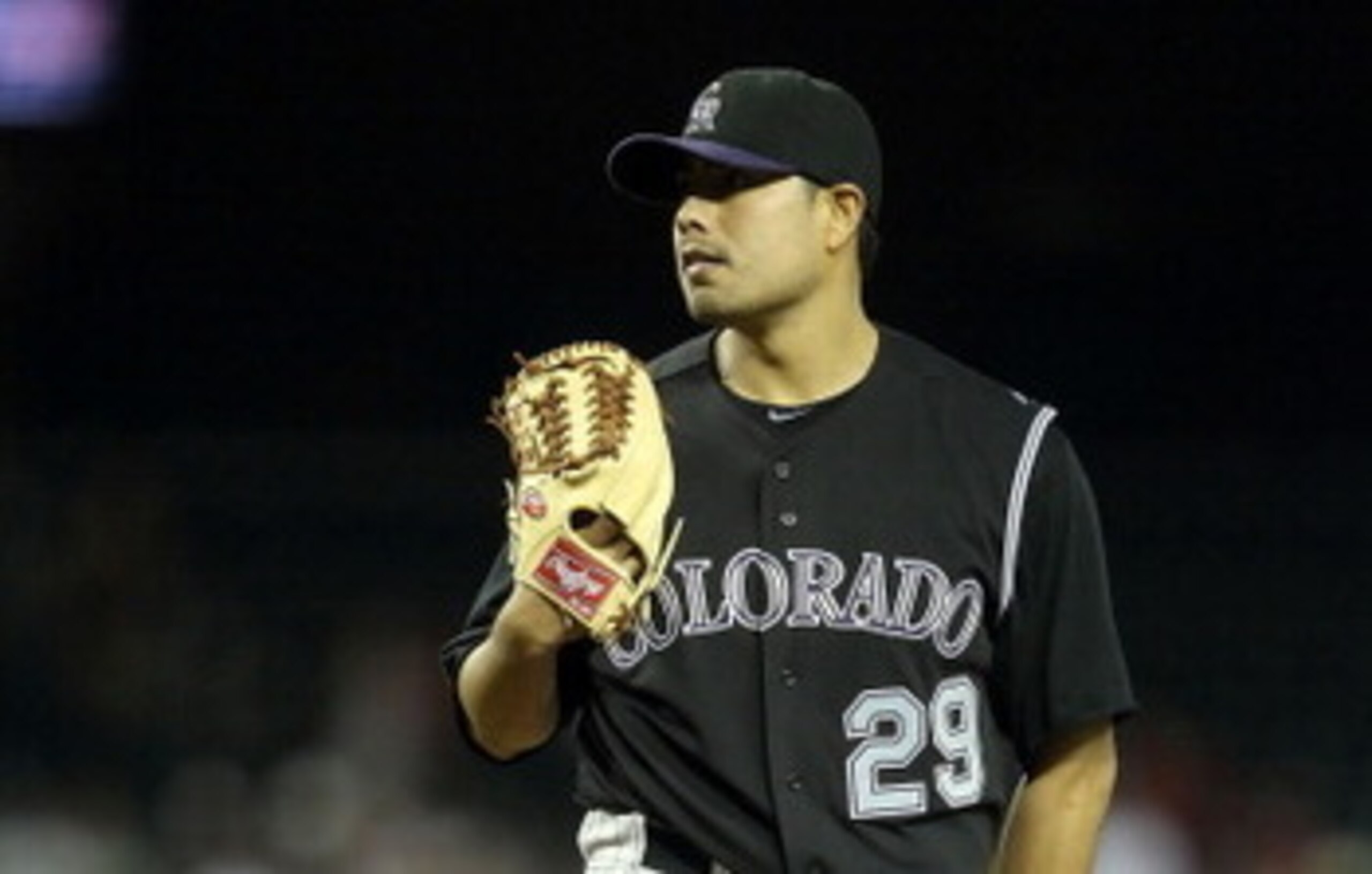 PHOENIX, AZ - MAY 03:  Starting pitcher Jorge De La Rosa #29 of the Colorado Rockies pitches against the Arizona Diamondbacks during the Major League Baseball game at Chase Field on May 3, 2011 in Phoenix, Arizona.  The Diamondbacks defeated the Rockies 4