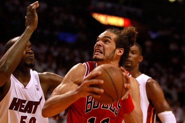 MIAMI, FL - MAY 24:  Joakim Noah #13 of the Chicago Bulls moves the ball inside against Joel Anthony #50 of the Miami Heat in Game Four of the Eastern Conference Finals during the 2011 NBA Playoffs on May 24, 2011 at American Airlines Arena in Miami, Flor