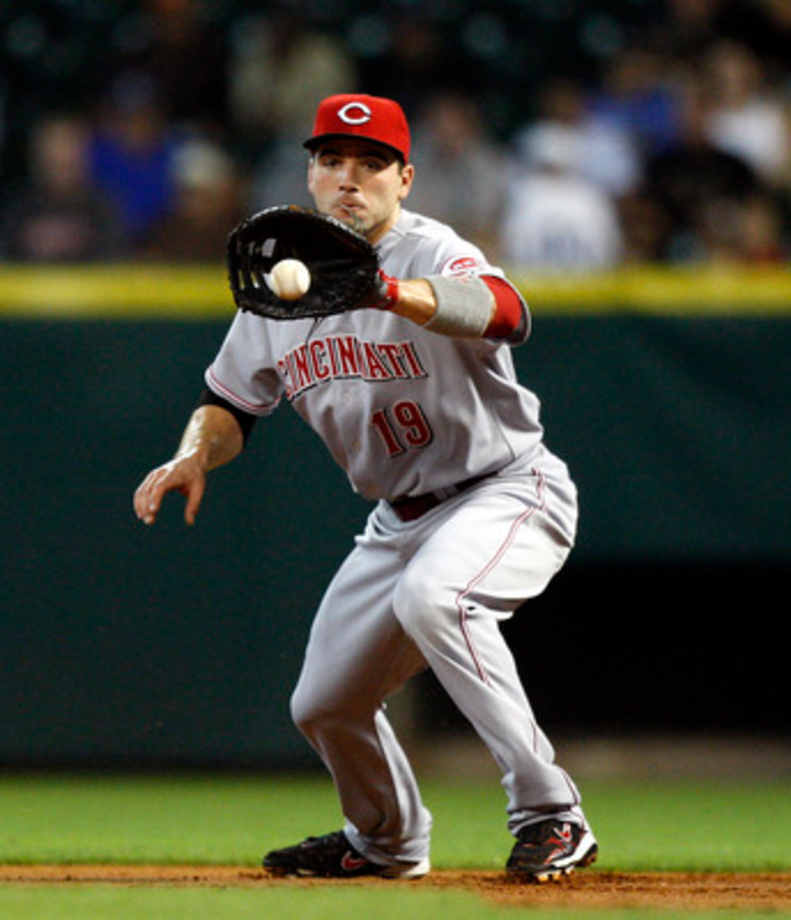 HOUSTON - MAY 11: First baseman Joey Votto #19 of the Cincinnati Reds fields a ground ball during a baseball game against the Houston Astros at Minute Maid Park on May 11, 2011 in Houston, Texas. (Photo by Bob Levey/Getty Images) HOUSTON - MAY 11: First baseman Joey Votto #19 of the Cincinnati Reds fields a ground ball during a baseball game against the Houston Astros at Minute Maid Park on May 11, 2011 in Houston, Texas. (Photo by Bob Levey/Getty Images)
