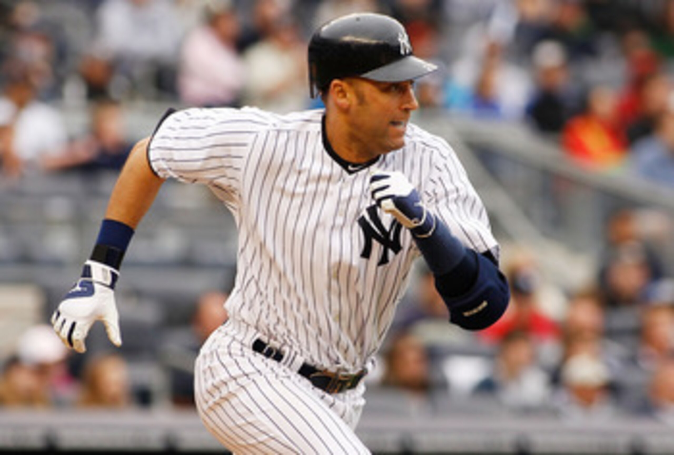 NEW YORK - MAY 22:  Derek Jeter #2 of the New York Yankees hits a two run single in the seventh inning to tie the game a three against the New York Mets on May 22, 2011 at Yankee Stadium in the Bronx borough of New York City. Yankees defeat the Mets 9-3.