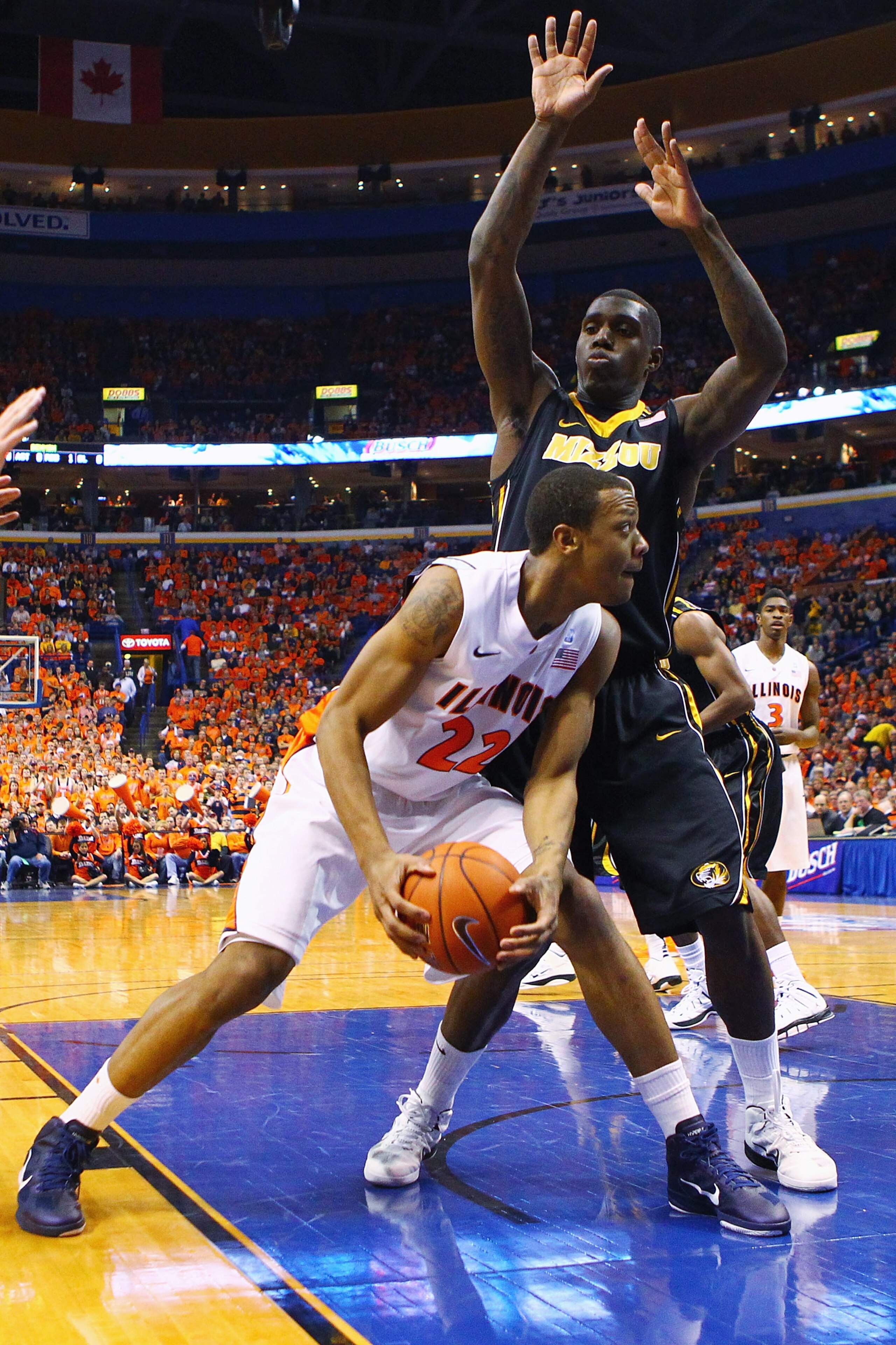 ST. LOUIS, MO - DECEMBER 22: Jereme Richmond #22 of the Illinois Fighting Illini drives to the basket against Ricardo Ratliffe #10 of the Missouri Tigers during the Busch Braggin' Rights game at the Scottrade Center on December 22, 2010 in St. Louis, Miss