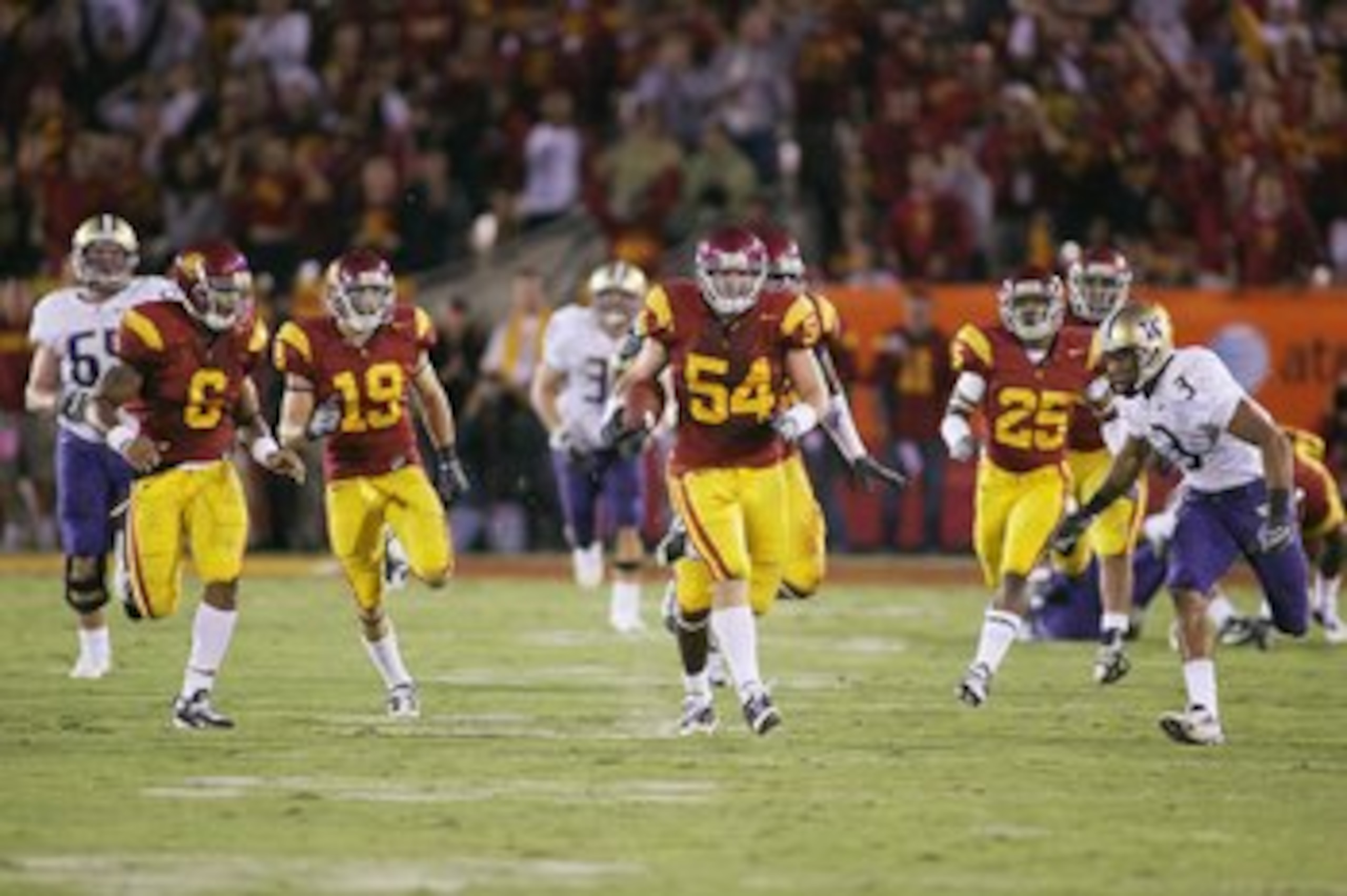 LOS ANGELES - NOVEMBER 1:  Chris Galippo #54 of the USC Trojans returns an interception 50 yards against the Washington Huskies in the fourth quarter on November 1, 2008 at the Los Angeles Memorial Coliseum in Los Angeles, California.  USC won 56-0.  (Pho