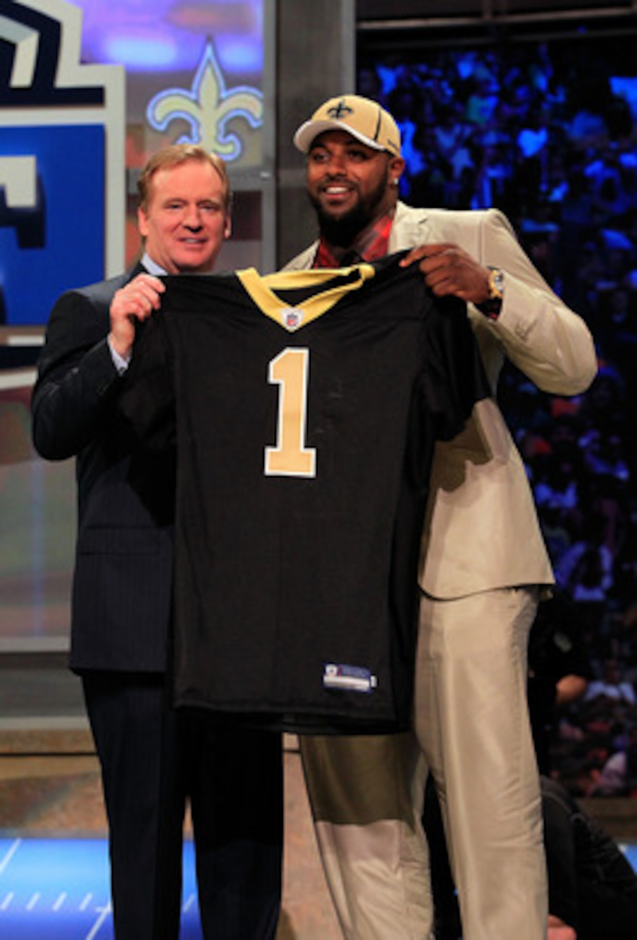 NEW YORK, NY - APRIL 28: NFL Commissioner Roger Goodell (L) poses for a photo with Cameron Jordan, #24 overall pick by the New Orleans Saints, holds up a jersey on stage during the 2011 NFL Draft at Radio City Music Hall on April 28, 2011 in New York Cit NEW YORK, NY - APRIL 28: NFL Commissioner Roger Goodell (L) poses for a photo with Cameron Jordan, #24 overall pick by the New Orleans Saints, holds up a jersey on stage during the 2011 NFL Draft at Radio City Music Hall on April 28, 2011 in New York Cit
