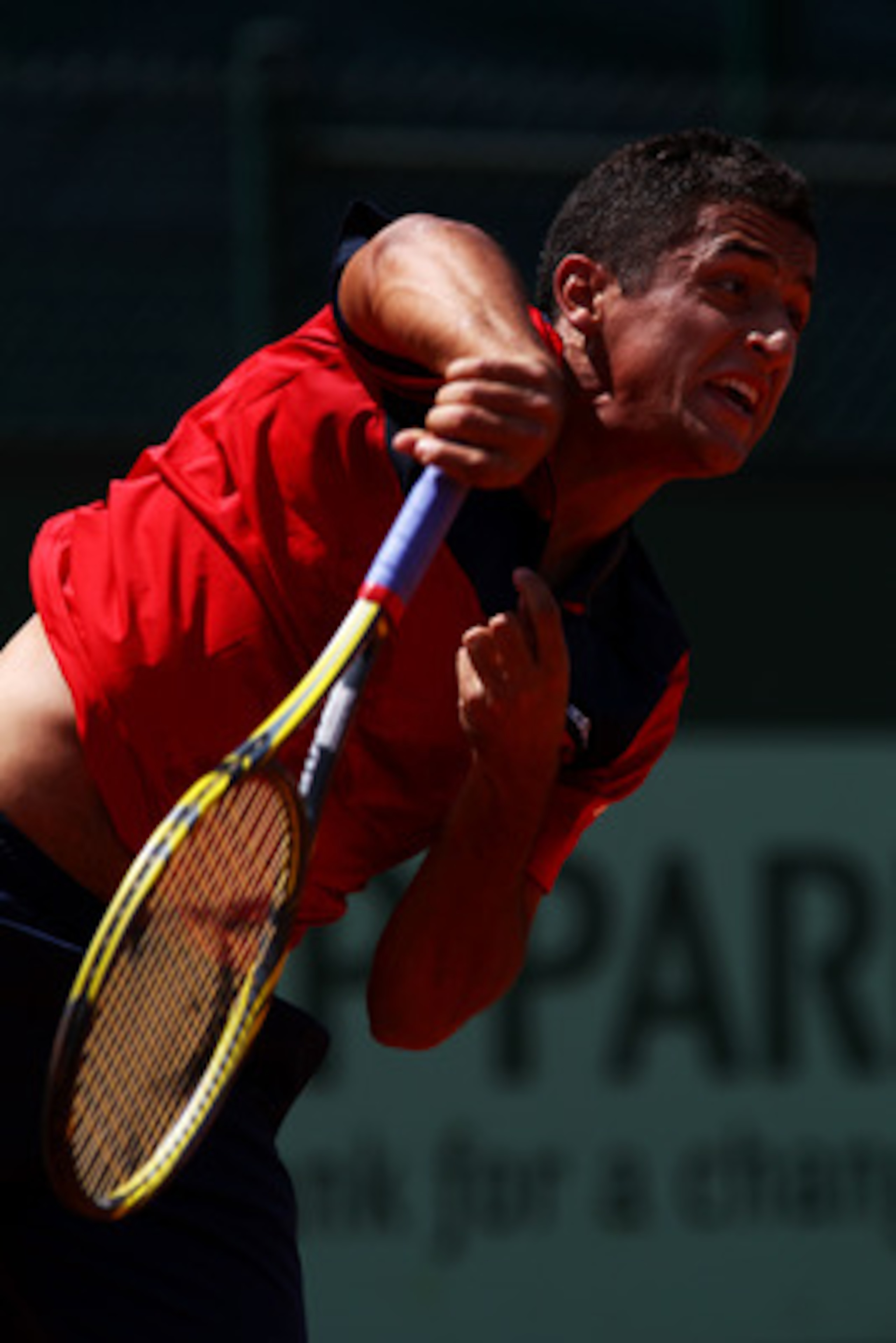 PARIS, FRANCE - MAY 24:  Nicolas Almagro of Spain serves during the men's singles round one match between Nicolas Almagro of Spain and Lukasz Kubot of Poland on day three of the French Open at Roland Garros on May 24, 2011 in Paris, France.  (Photo by Ale