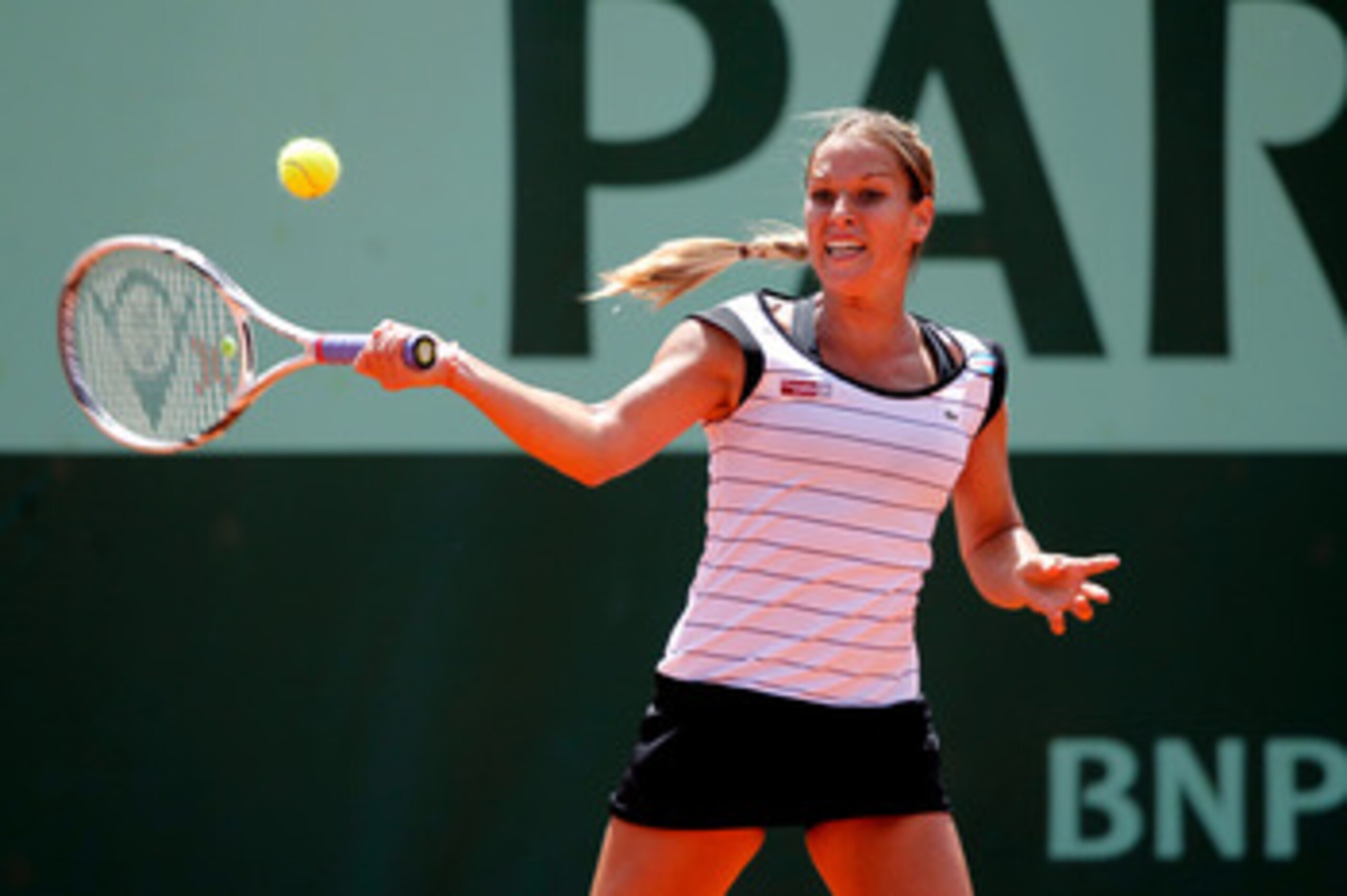 PARIS, FRANCE - MAY 24:  Dominika Cibulkova of Slovakia hits a forehand during the women's singles round one match between Dominika Cibulkova of Slovakia and Vania King of USA on day three of the French Open at Roland Garros on May 24, 2011 in Paris, Fran