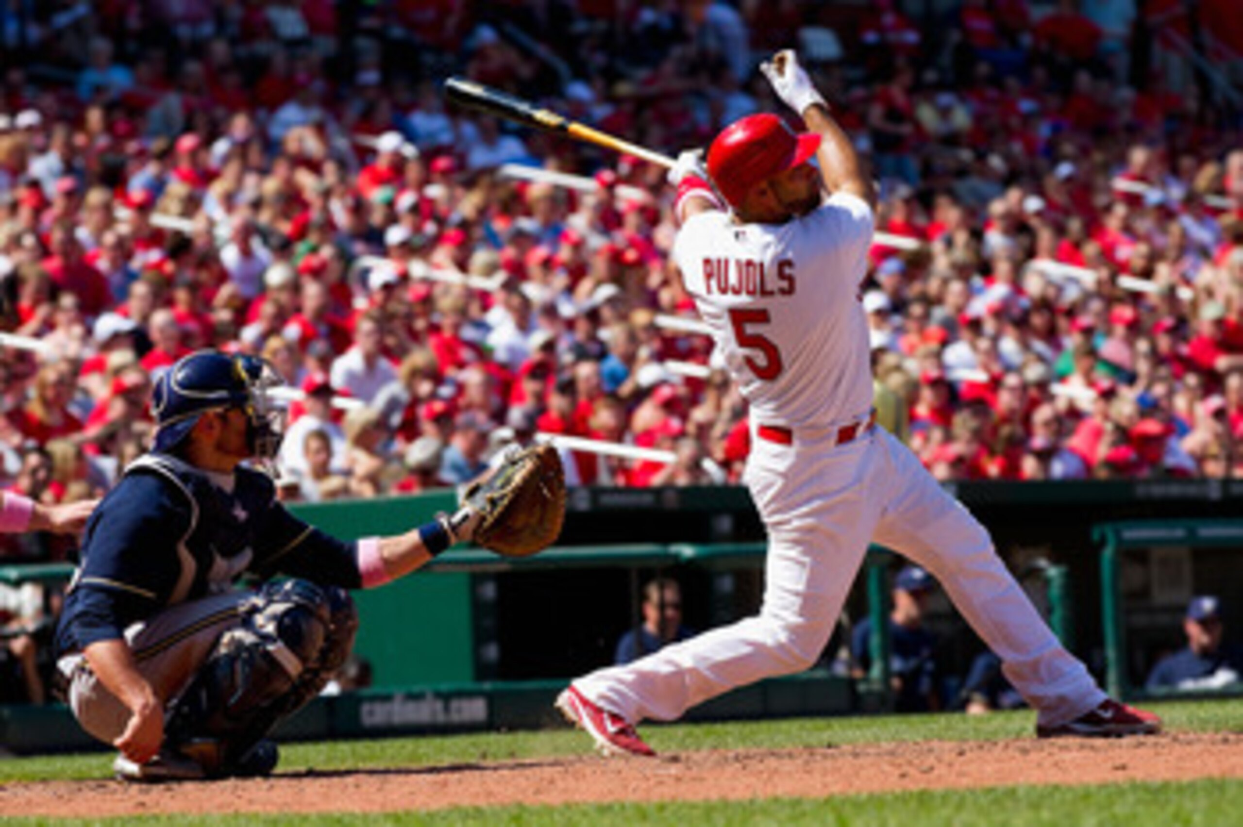 ST. LOUIS, MO - MAY 8: Albert Pujols #5 of the St. Louis Cardinals hits a double against the Milwaukee Brewers at Busch Stadium on May 8, 2011 in St. Louis, Missouri.  (Photo by Dilip Vishwanat/Getty Images)