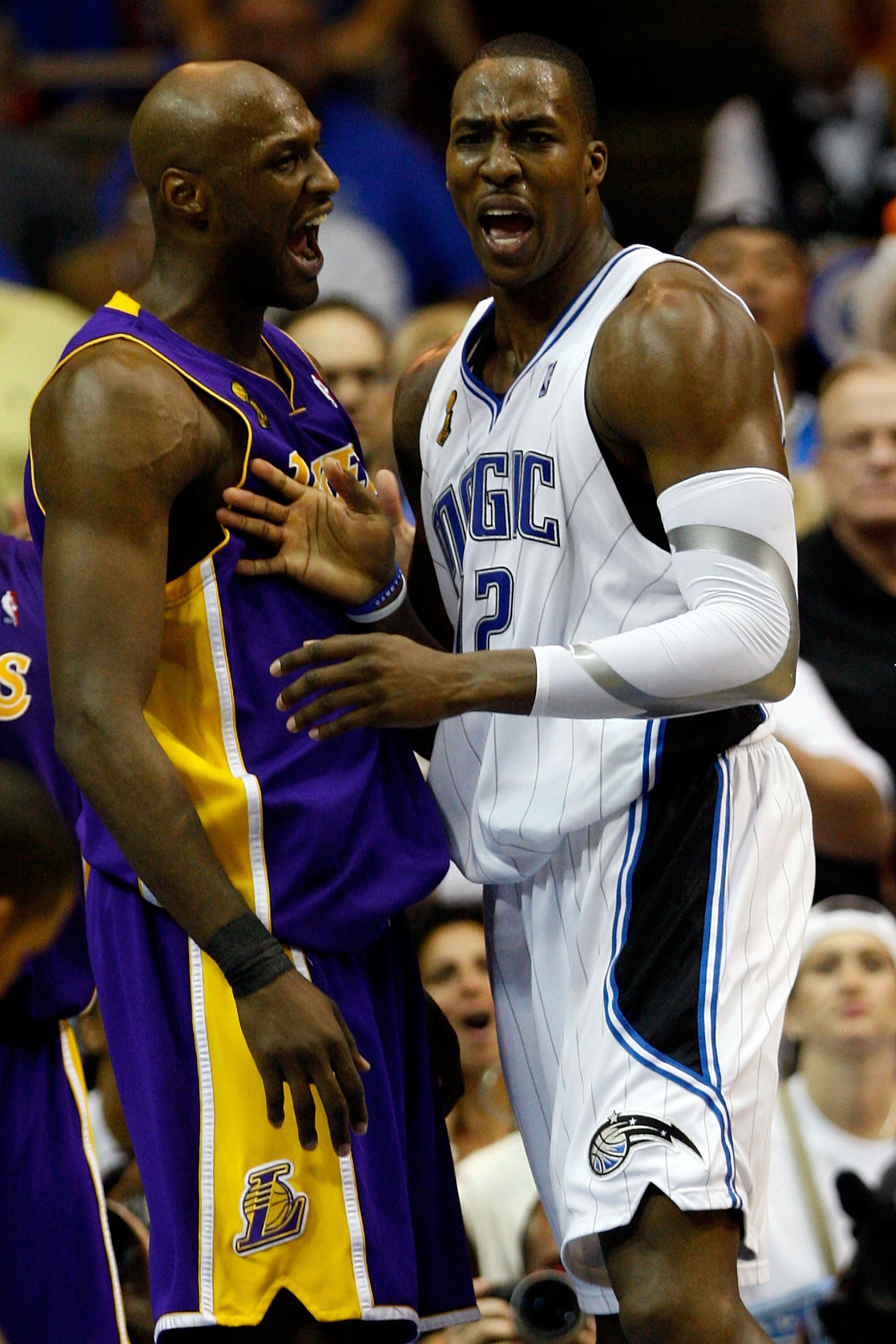 ORLANDO, FL - JUNE 11:  Lamar Odom #7 of the Los Angeles Lakers and Dwight Howard #12 of the Orlando Magic react in the fourth quarter of Game Four of the 2009 NBA Finals on June 11, 2009 at Amway Arena in Orlando, Florida.  NOTE TO USER:  User expressly