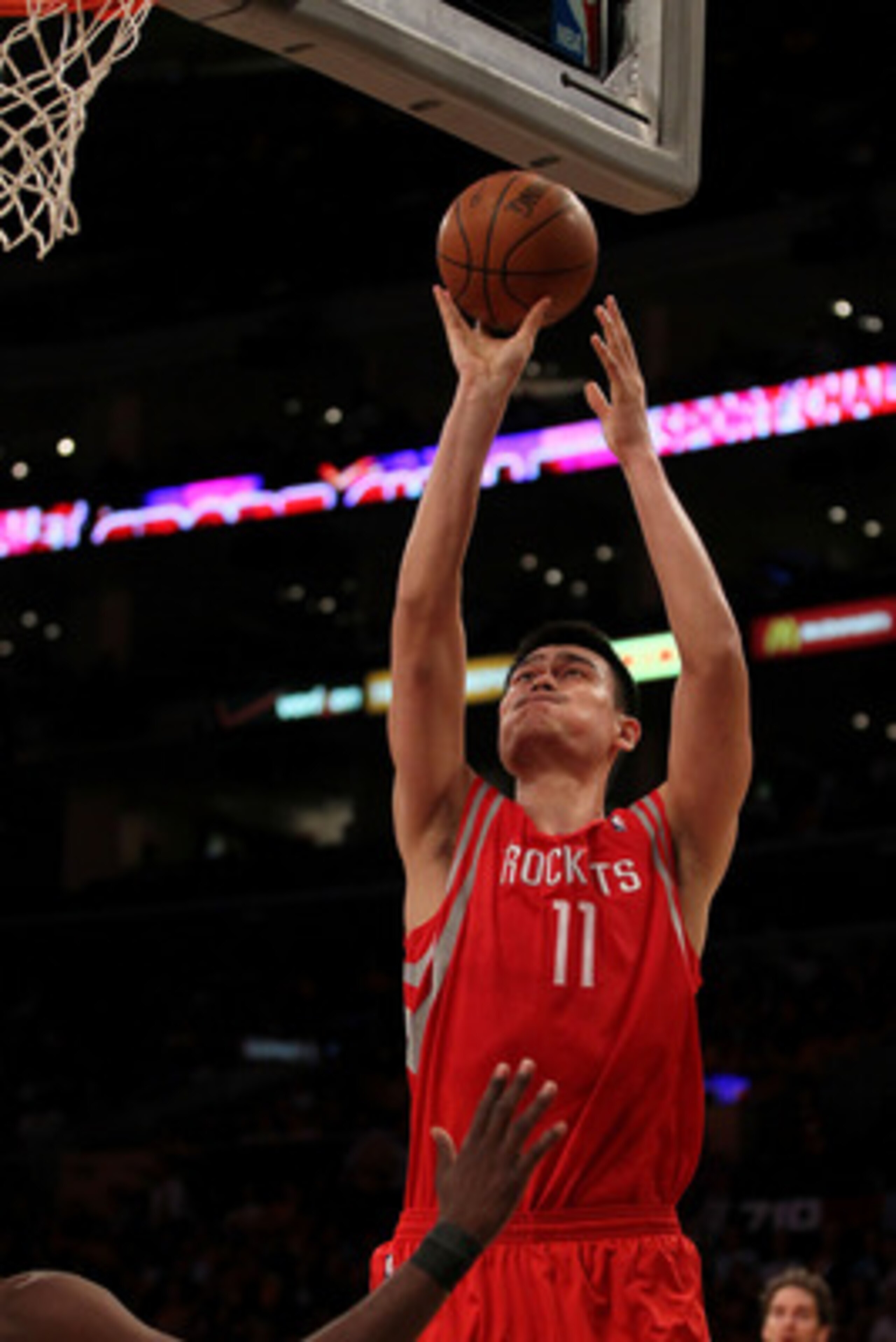 LOS ANGELES, CA - OCTOBER 26: Yao Ming #11 of the Houston Rockets takes a shot against the Los Angeles Lakers during their game at Staples Center on October 26, 2010 in Los Angeles, California. NOTE TO USER: User expressly acknowledges and agrees that, b LOS ANGELES, CA - OCTOBER 26: Yao Ming #11 of the Houston Rockets takes a shot against the Los Angeles Lakers during their game at Staples Center on October 26, 2010 in Los Angeles, California. NOTE TO USER: User expressly acknowledges and agrees that, b