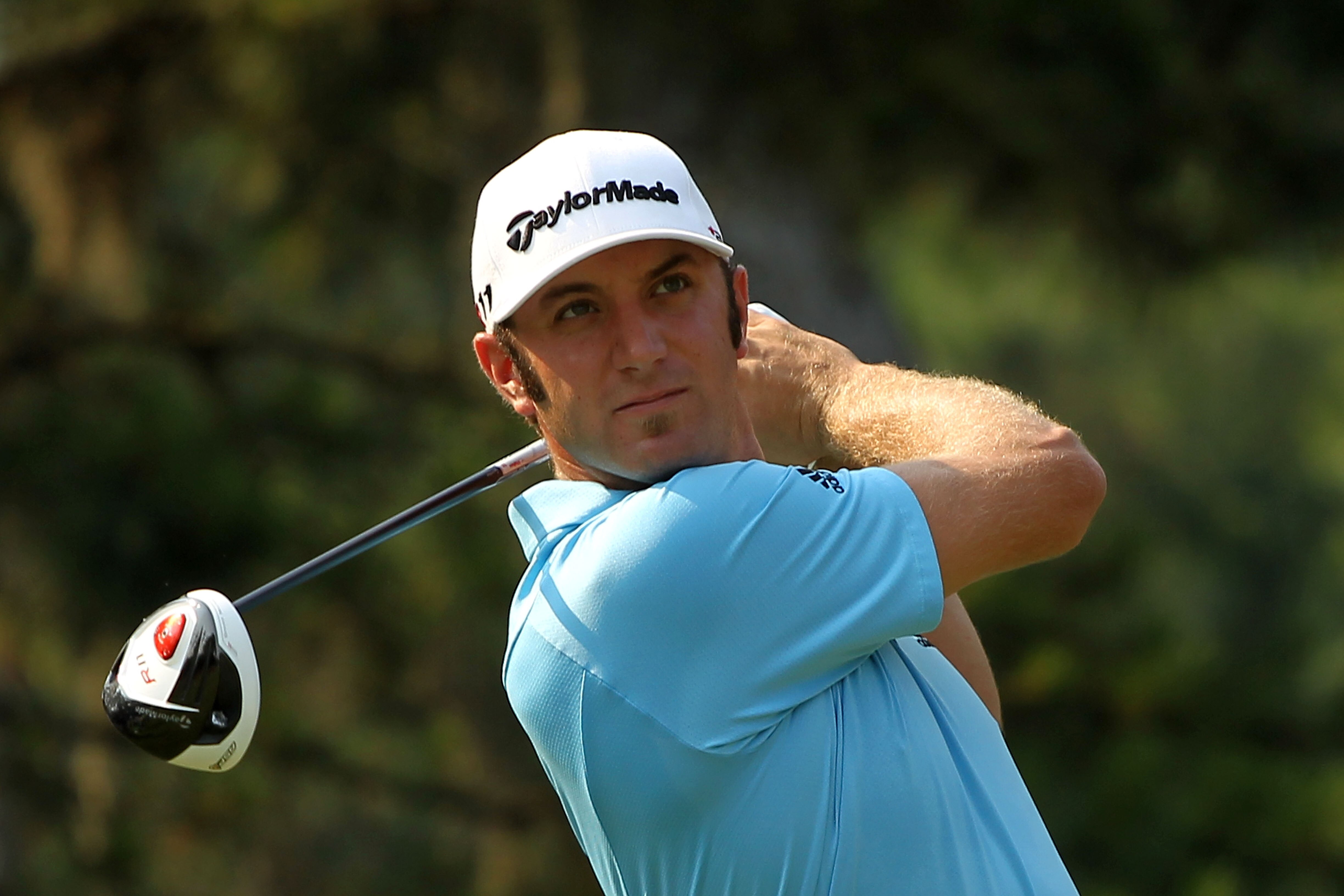 PONTE VEDRA BEACH, FL - MAY 10:  Dustin Johnson hits a shot during a practice round prior to the start of THE PLAYERS Championship held at THE PLAYERS Stadium course at TPC Sawgrass on May 10, 2011 in Ponte Vedra Beach, Florida.  (Photo by Scott Halleran/