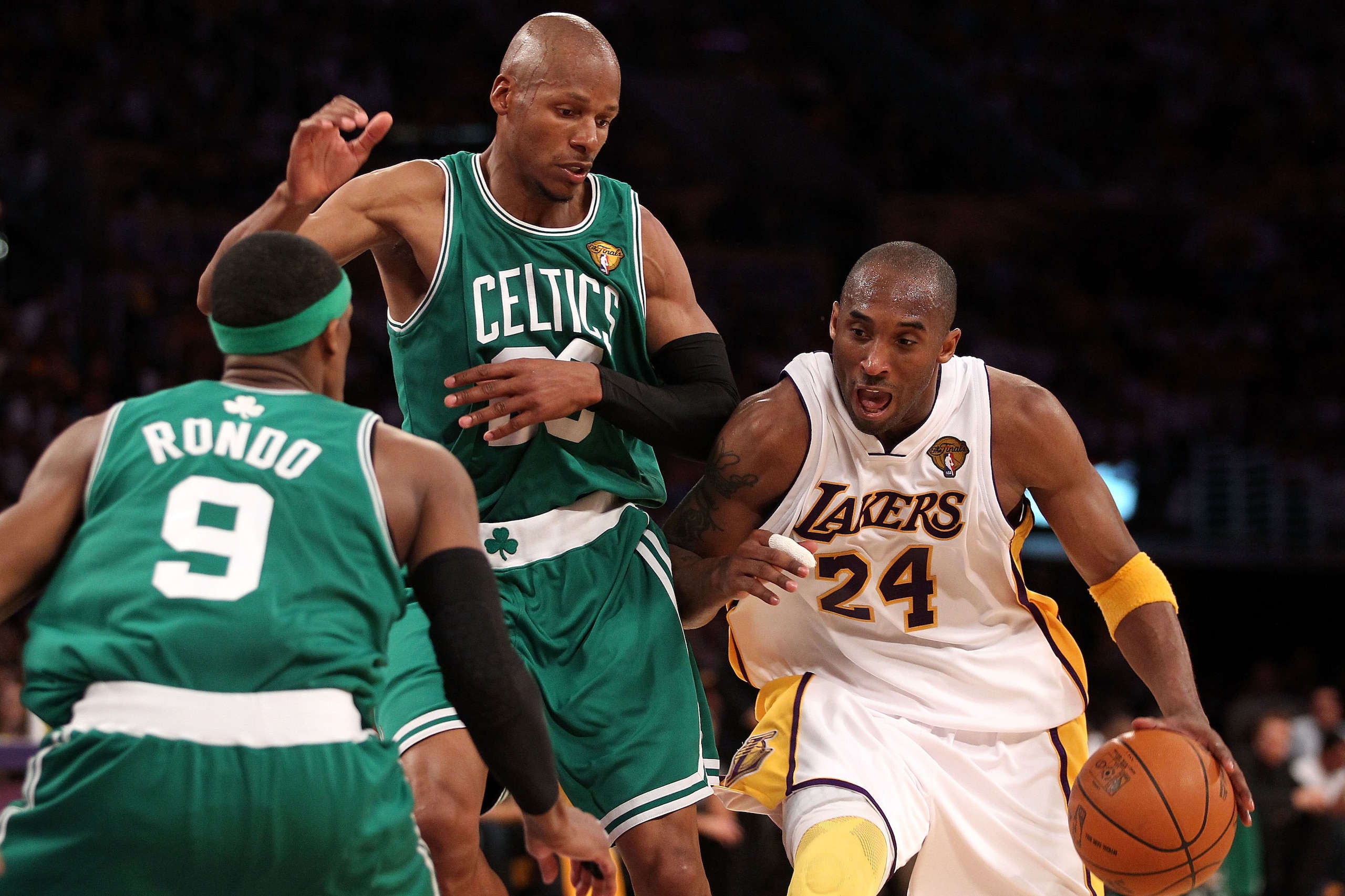 LOS ANGELES, CA - JUNE 06:  Kobe Bryant #24 of the Los Angeles Lakers drives against Ray Allen #20 and Rajon Rondo #9 of the Boston Celtics in Game Two of the 2010 NBA Finals at Staples Center on June 6, 2010 in Los Angeles, California. The Celtics won 10