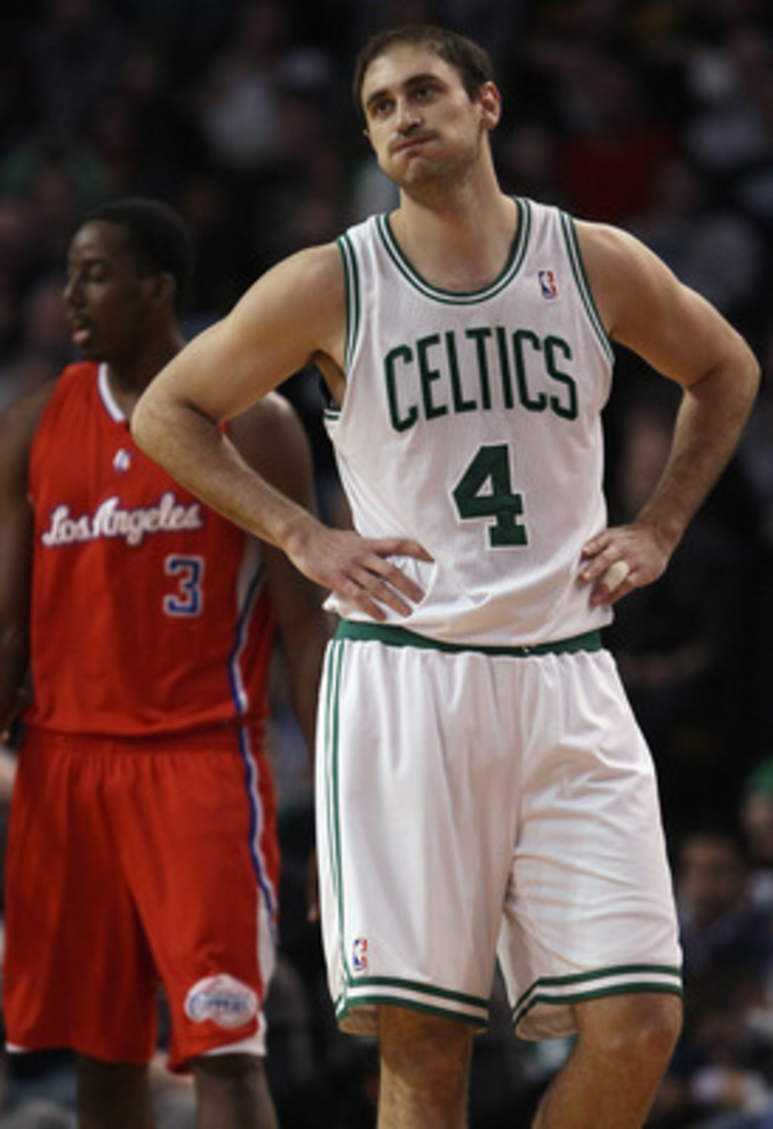 BOSTON, MA - MARCH 09:  Nenad Krstic #4 of the Boston Celtics reacts to a call against the Celtics in the first half as Al-Farouq Aminu #3 of the Los Angeles Clippers stands by on March 9, 2011 at the TD Garden in Boston, Massachusetts. NOTE TO USER: User