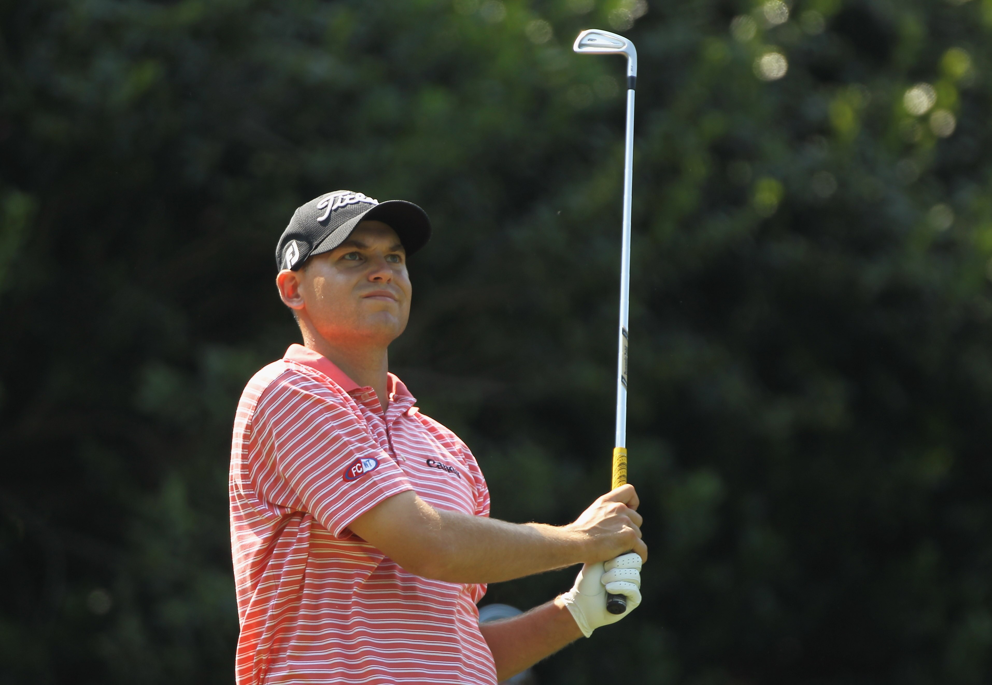 CHARLOTTE, NC - MAY 08:  Bill Haas watches his tee shot on the 13th hole during the final round of the Wells Fargo Championship at the Quail Hollow Club on May 8, 2011 in Charlotte, North Carolina.  (Photo by Scott Halleran/Getty Images)