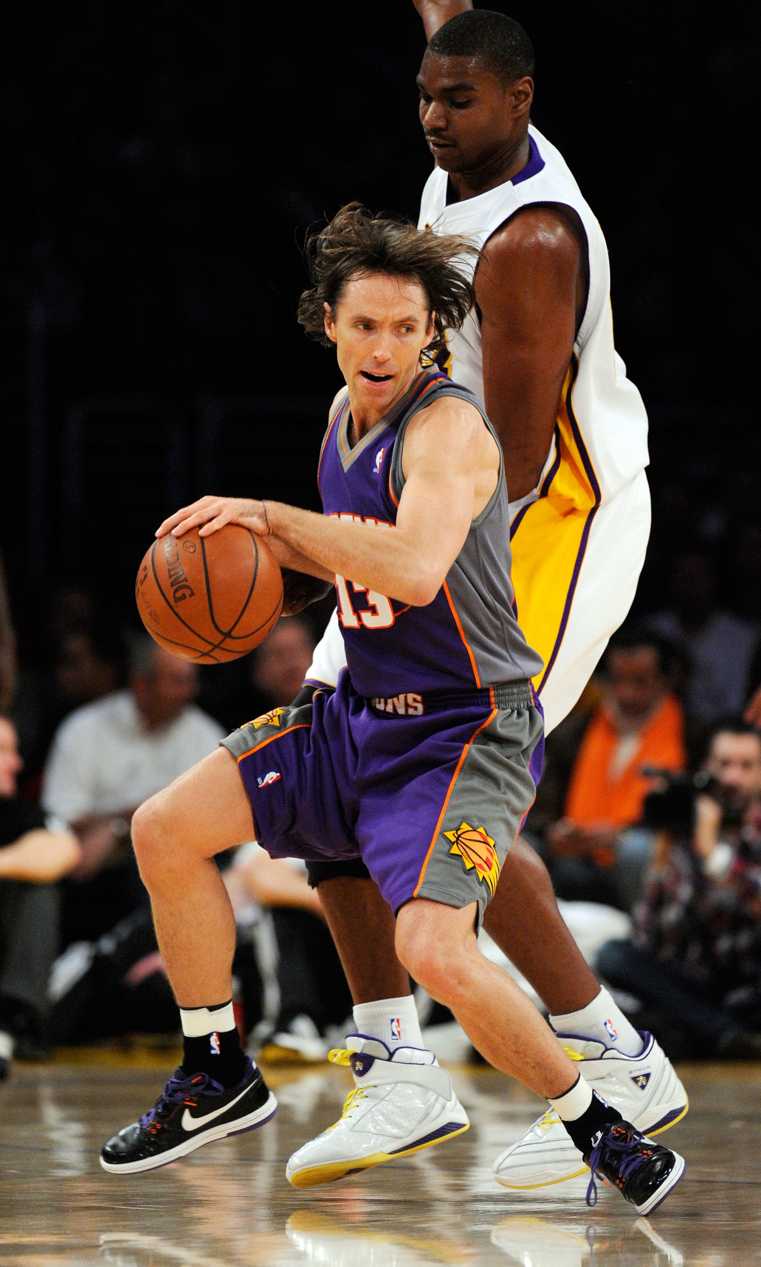 LOS ANGELES, CA - DECEMBER 06:  Steve Nash #13  of  the Phoenix Suns in action against Andrew Bynum #17 of the Los Angeles Lakers during the first quarter of the NBA basketball game at Staples Center on December 6, 2009 in Los Angeles, California. NOTE TO